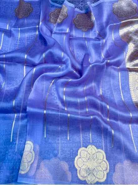 Light blue saree with gold border and floral motifs