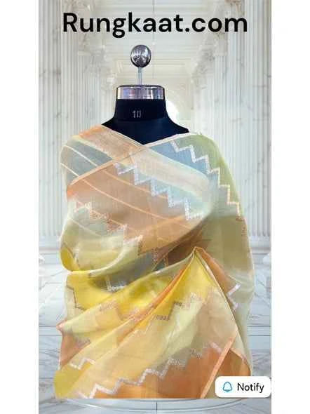 Yellow Banarasi handloom tissue saree with pastel zigzag border and weave details