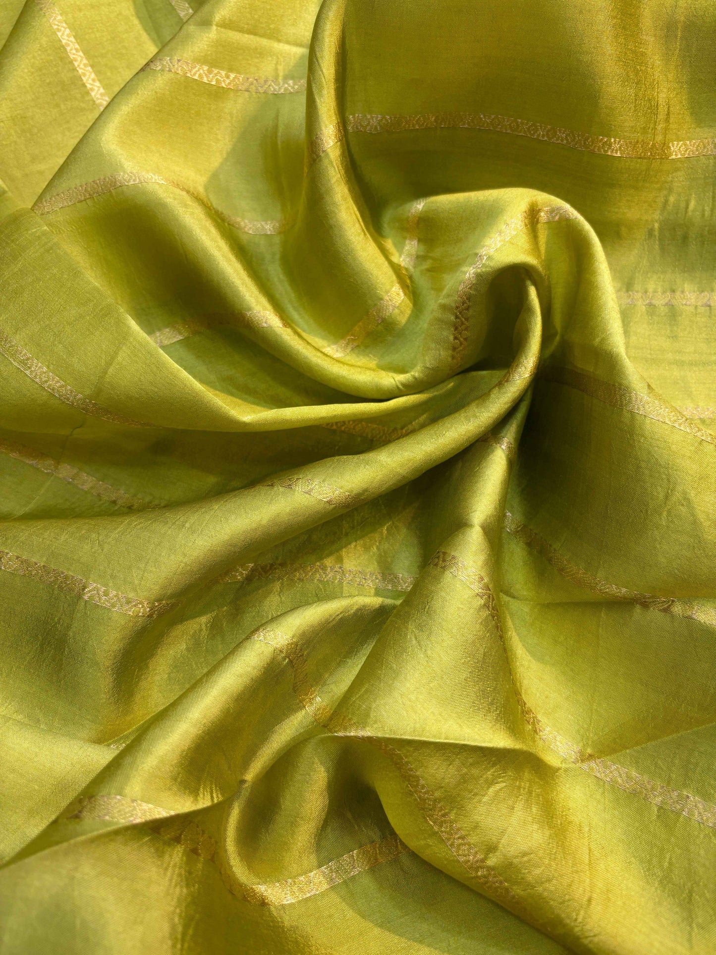Lemon yellow silk-like saree with shimmering stripes and subtle woven pattern