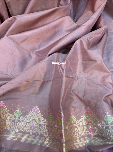 Banarasi-style saree close-up with mauve base, gold border, and floral embroidery