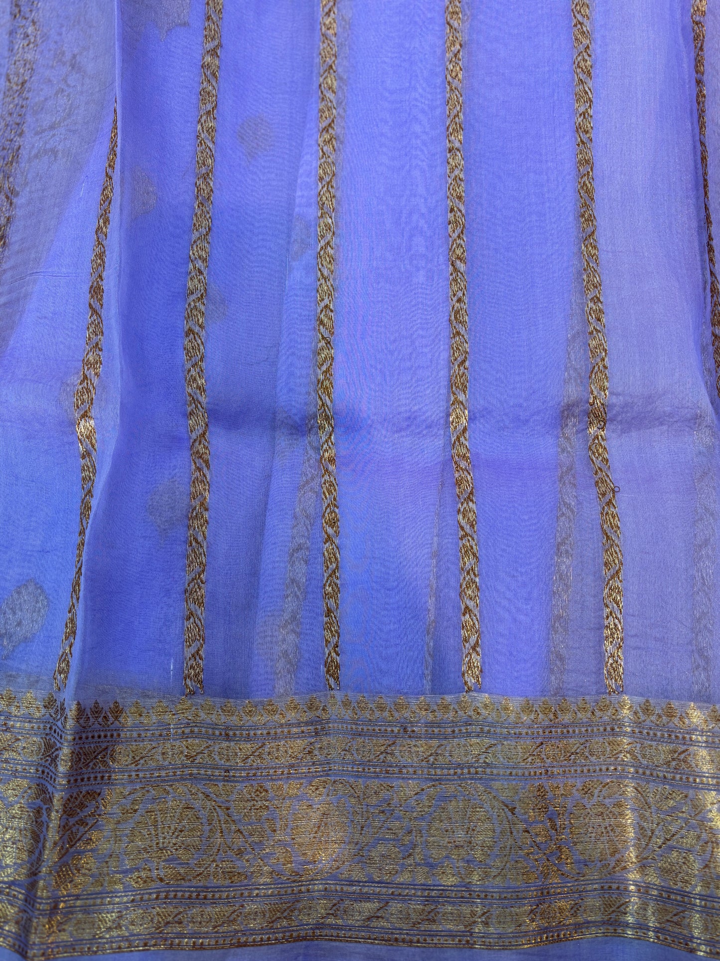 Lavender silk saree with gold zari stripes and ornate border panel