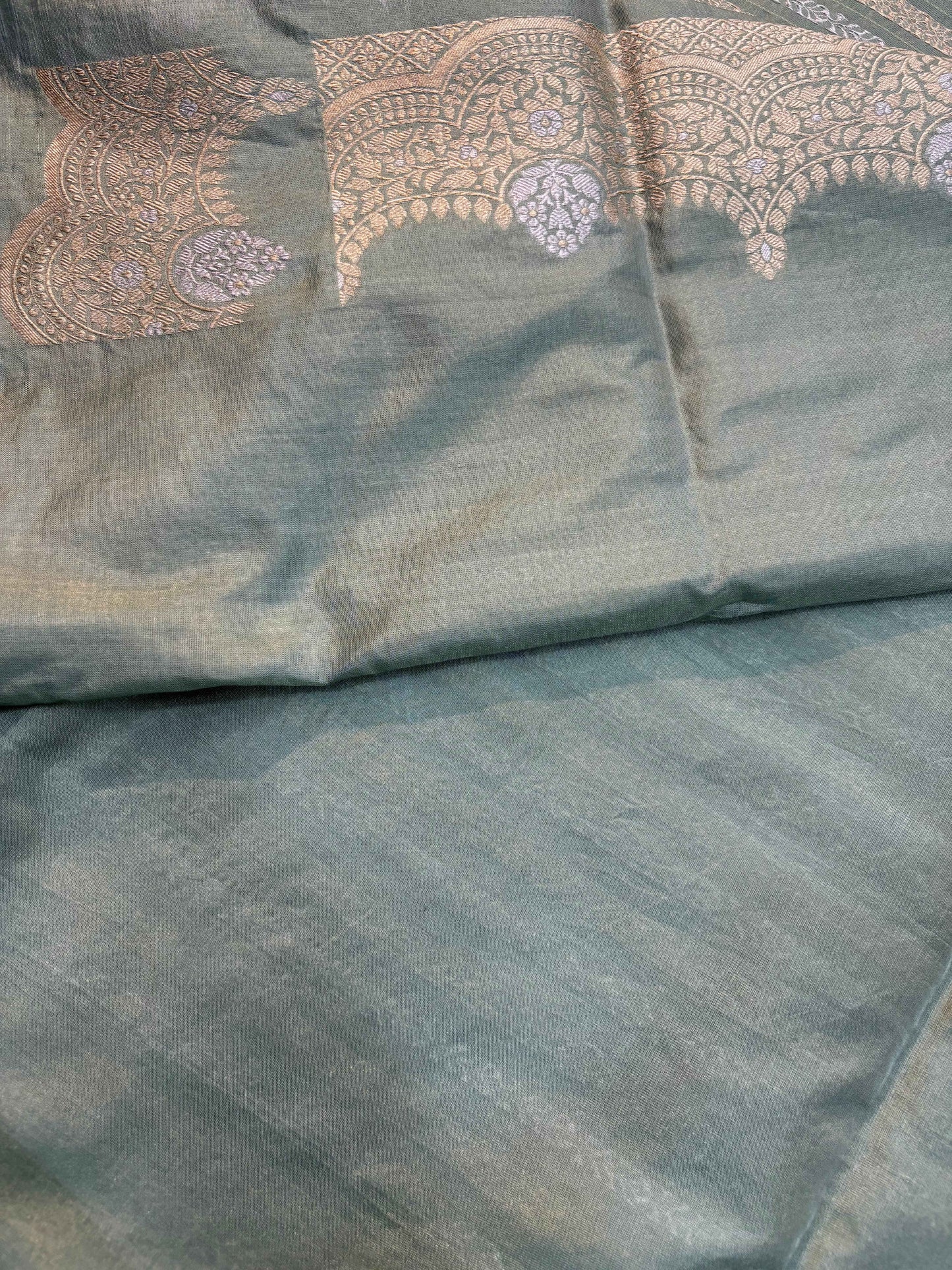 Light gray Banarasi handloom saree with jacquard pallu motifs and soft drape