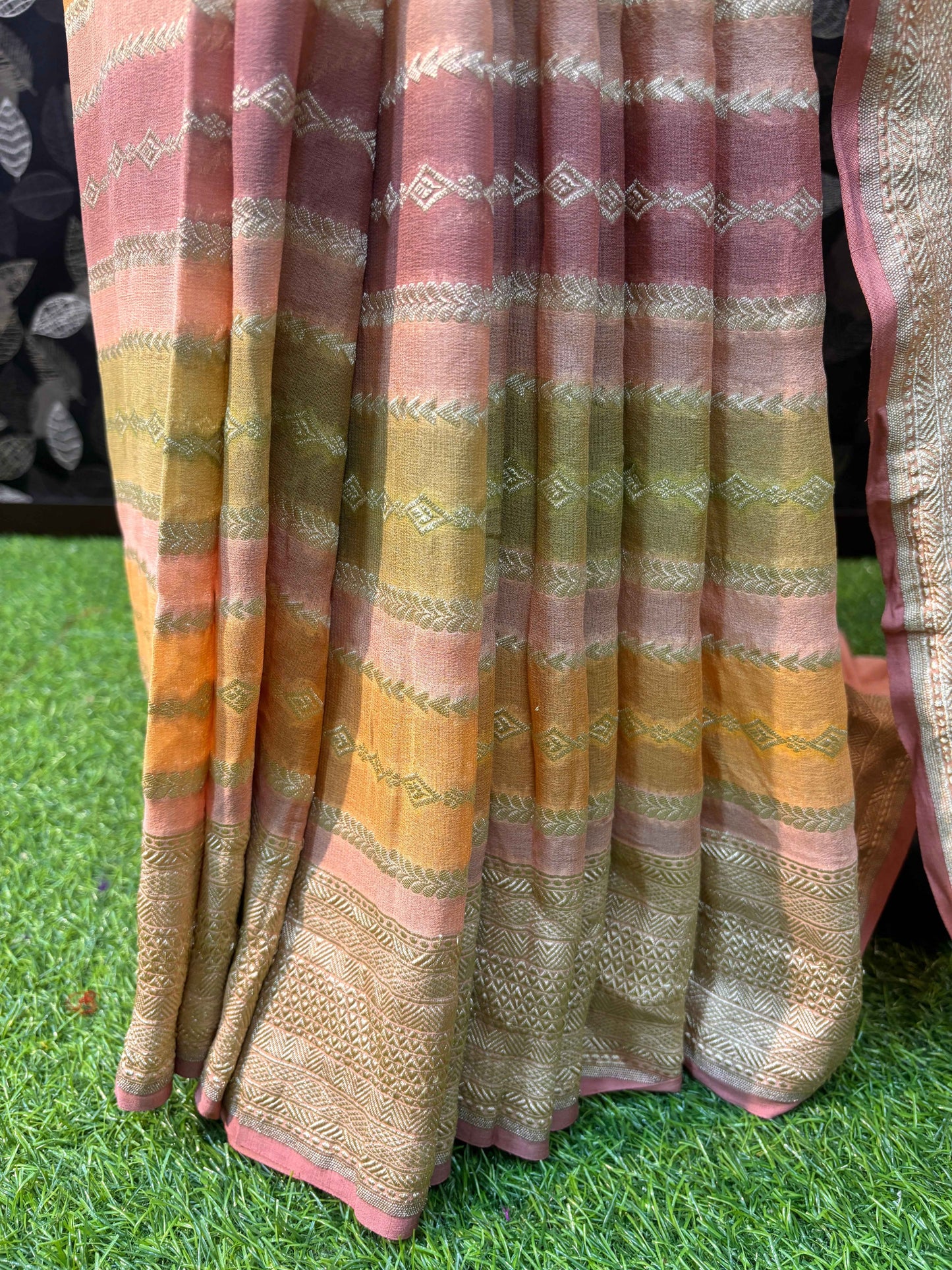 Banarasi saree with pleated drape, pastel horizontal stripes and gold woven accents