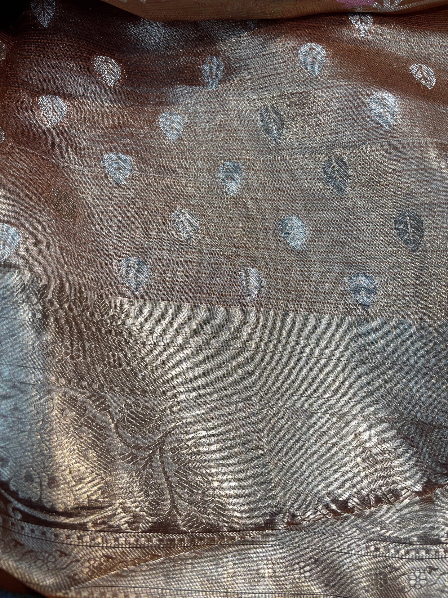 Grey saree fabric with silver zari border and small blue floral motifs