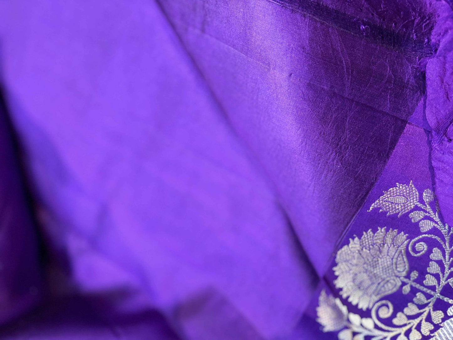 Purple sari with embroidered silver floral corner on lightweight woven fabric