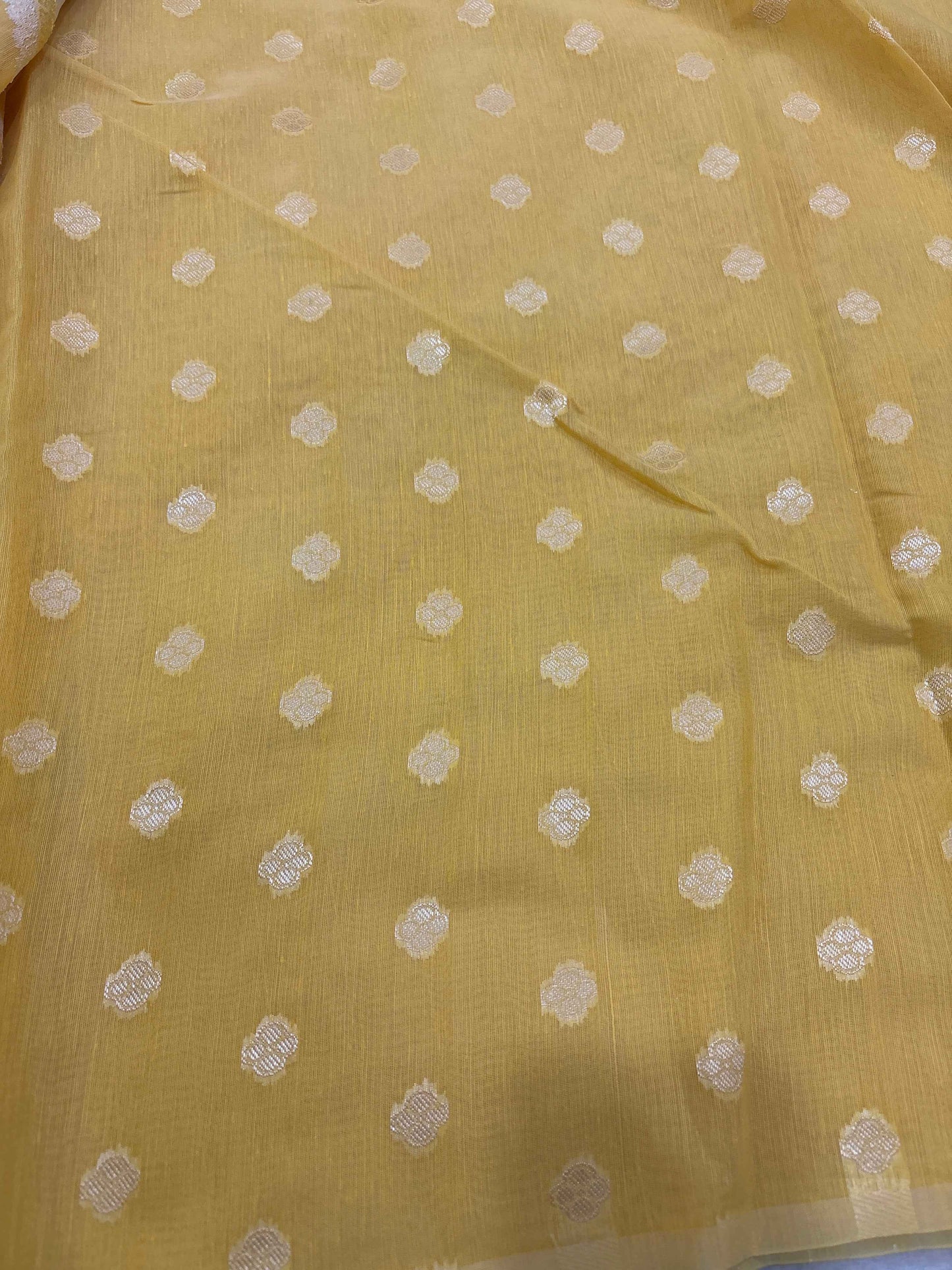 Yellow cotton Banarasi saree with small white floral dot motifs