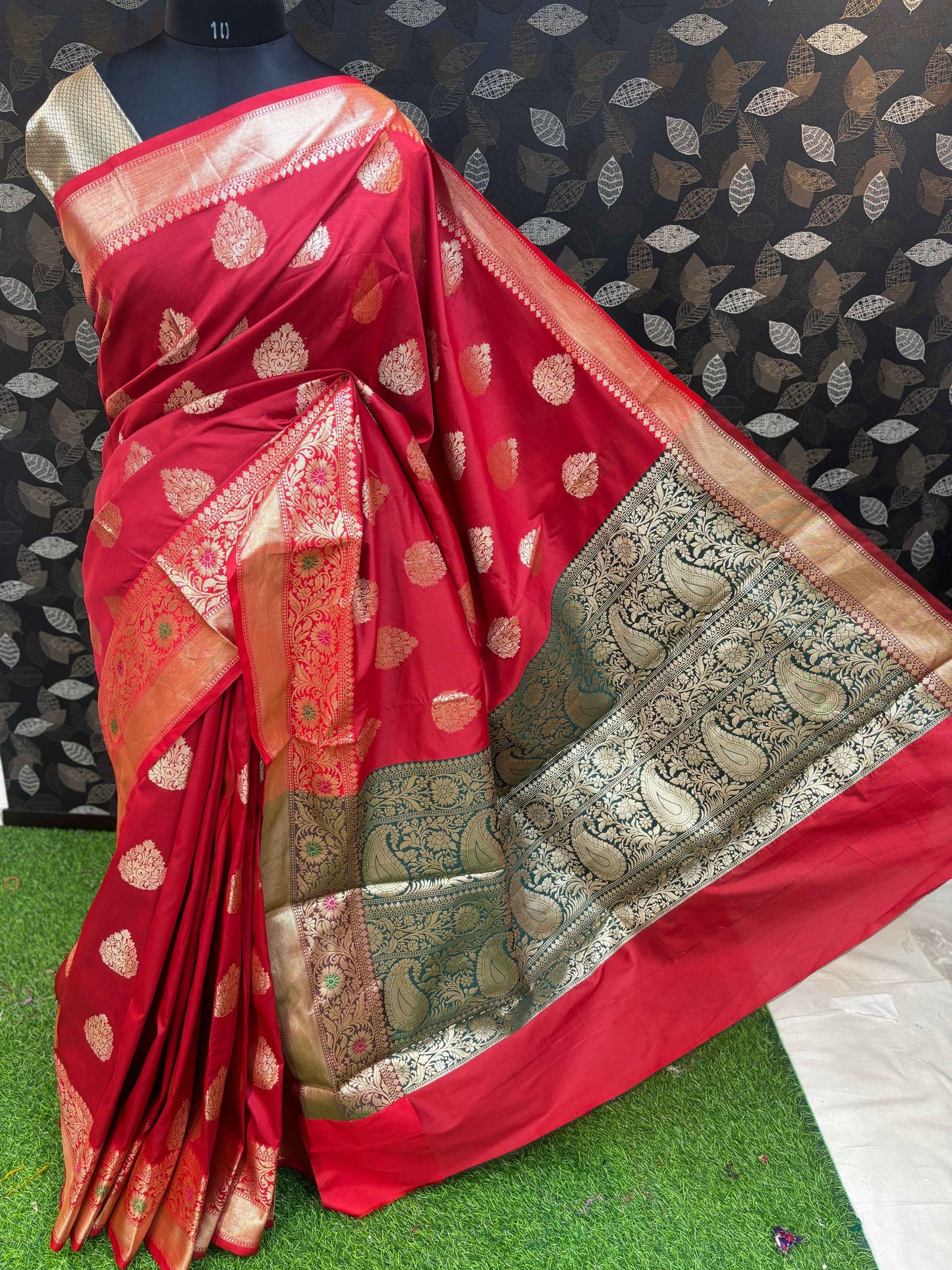 Red Banarasi saree with ornate gold-toned border and zari floral pattern
