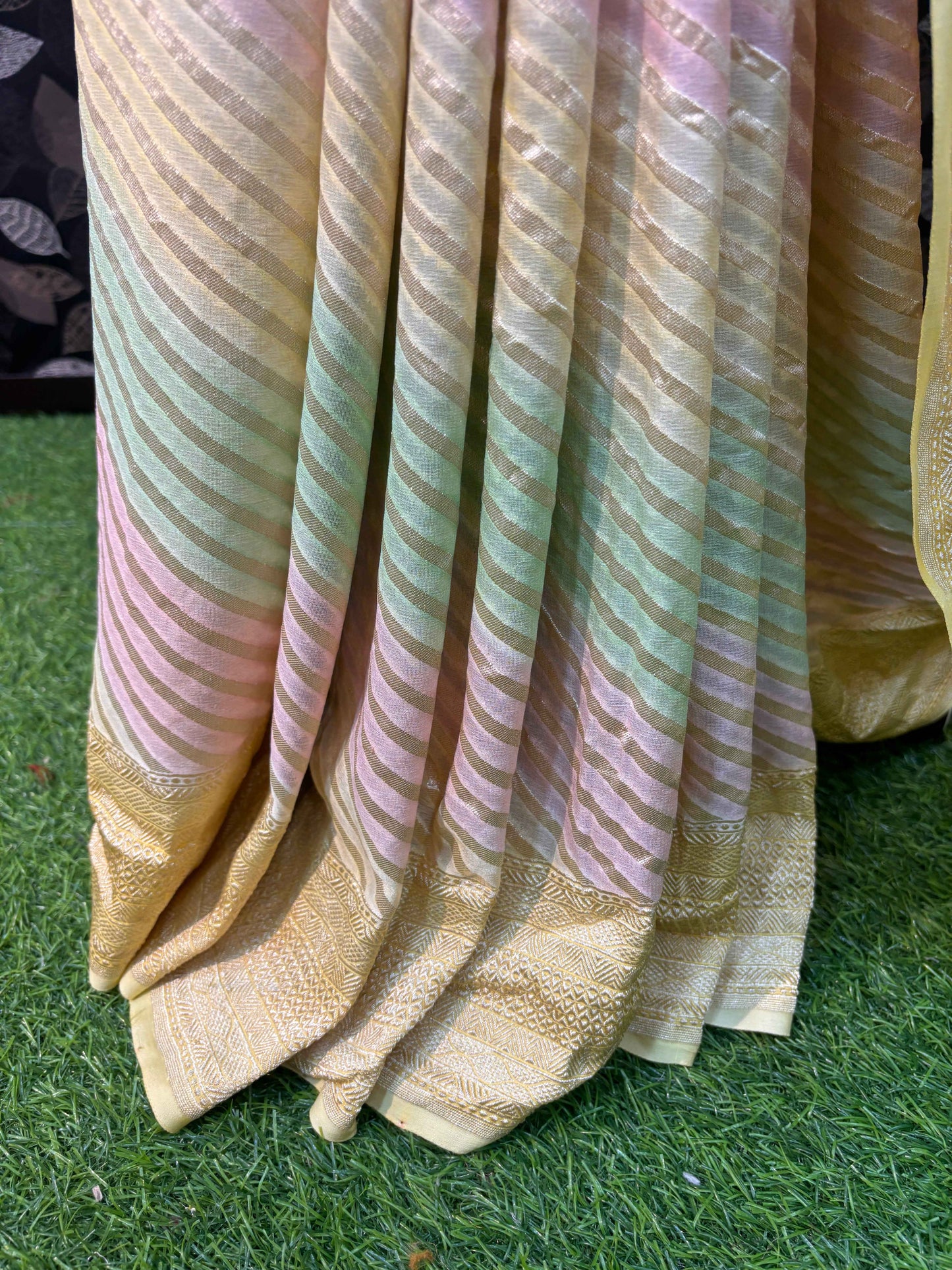 Light yellow saree with pastel pink and green stripes and gold zari edge