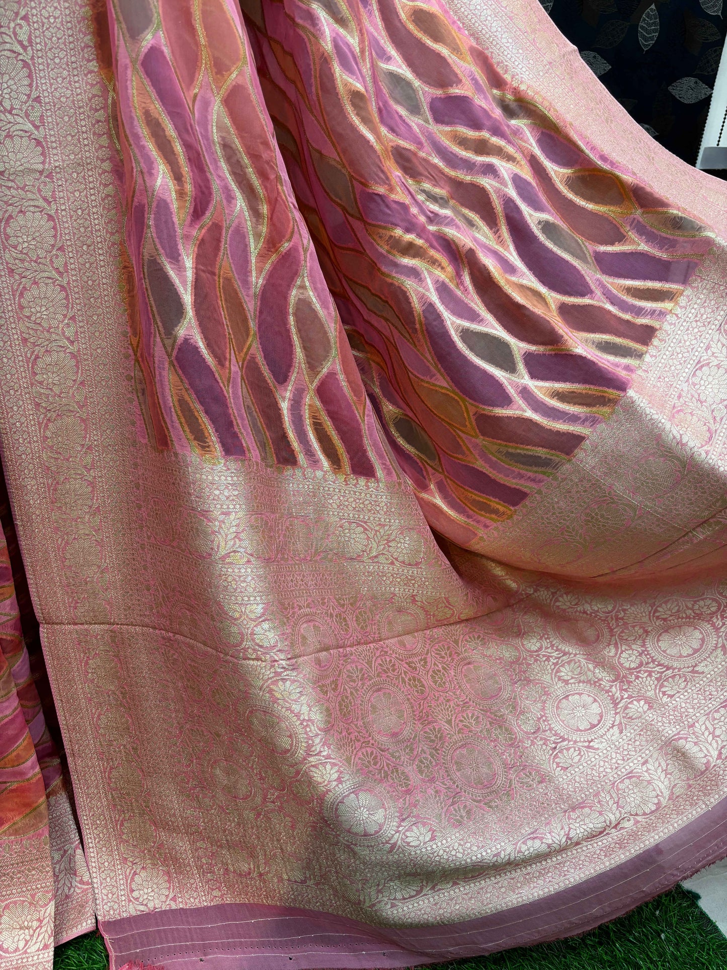 Light pink Banarasi georgette saree pallu with gold-toned waves and ornate sheen