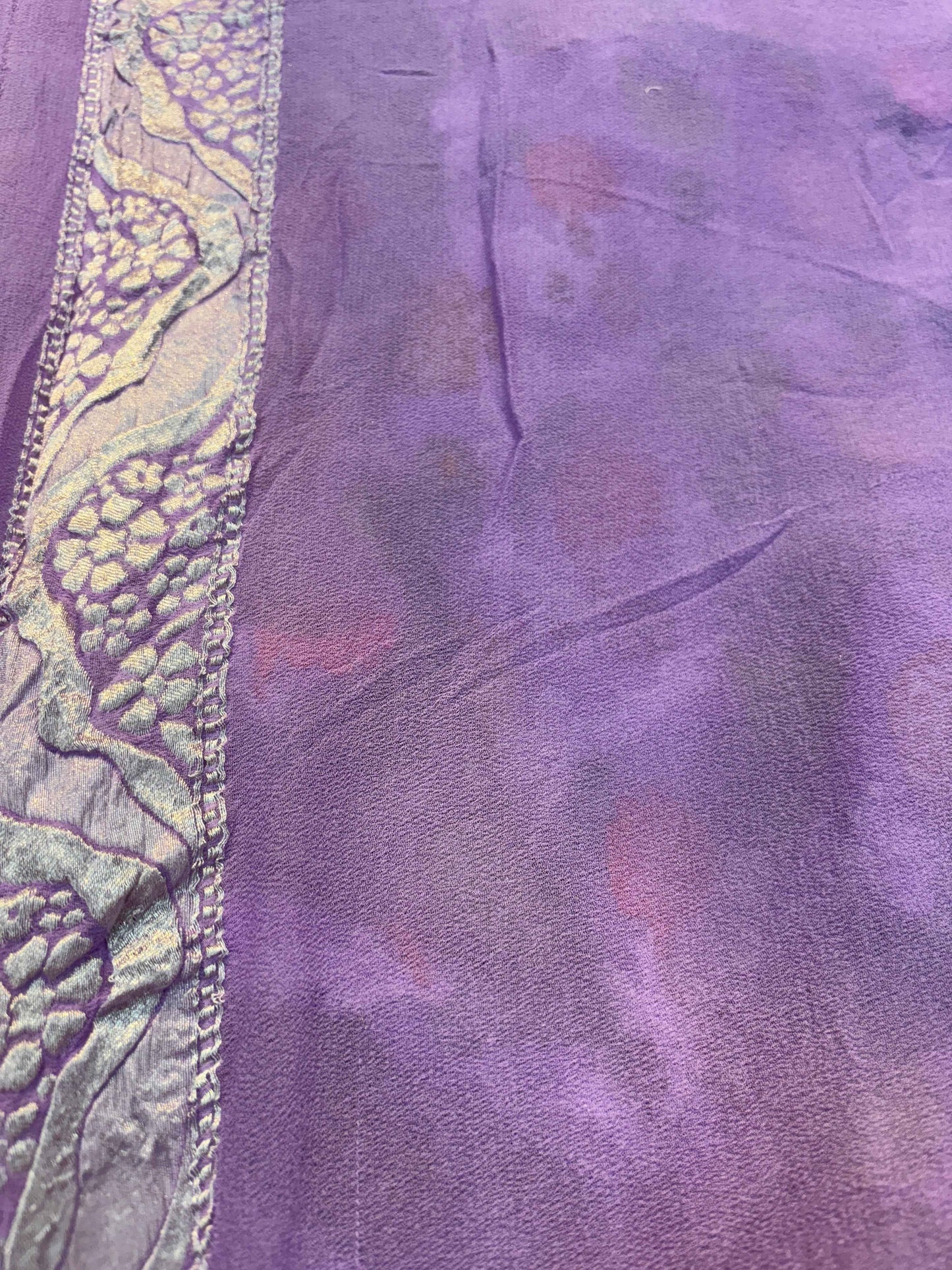 Lavender saree fabric with scalloped gold-trimmed border and fine texture