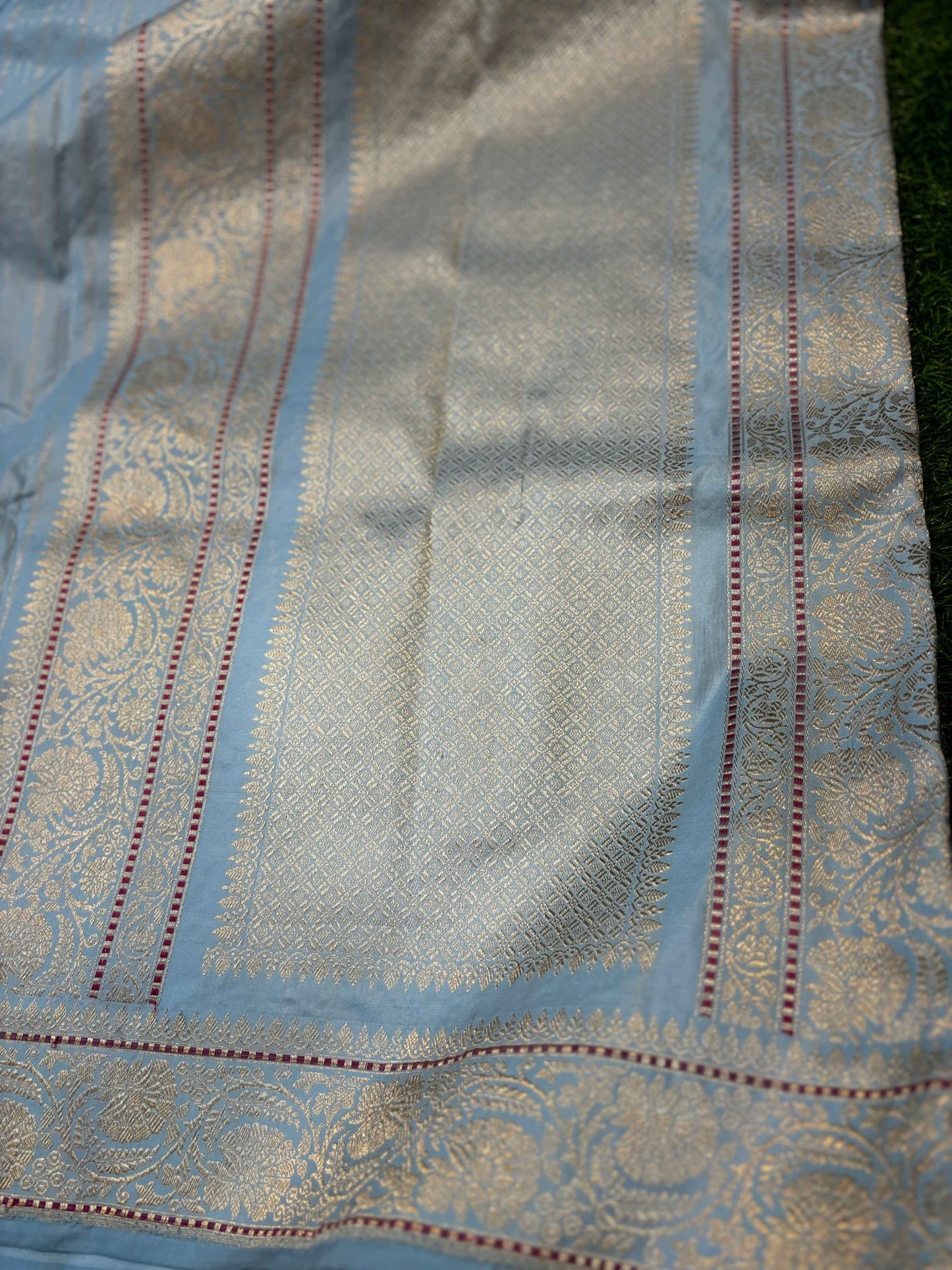 Powder blue saree panel with vertical multicolor stripes and gold border