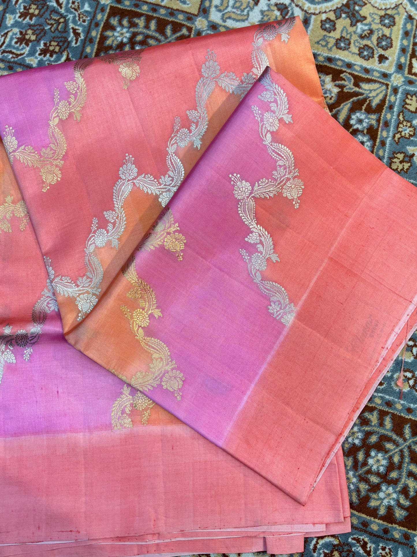 Pink handloom saree with gold and silver floral motifs and woven border