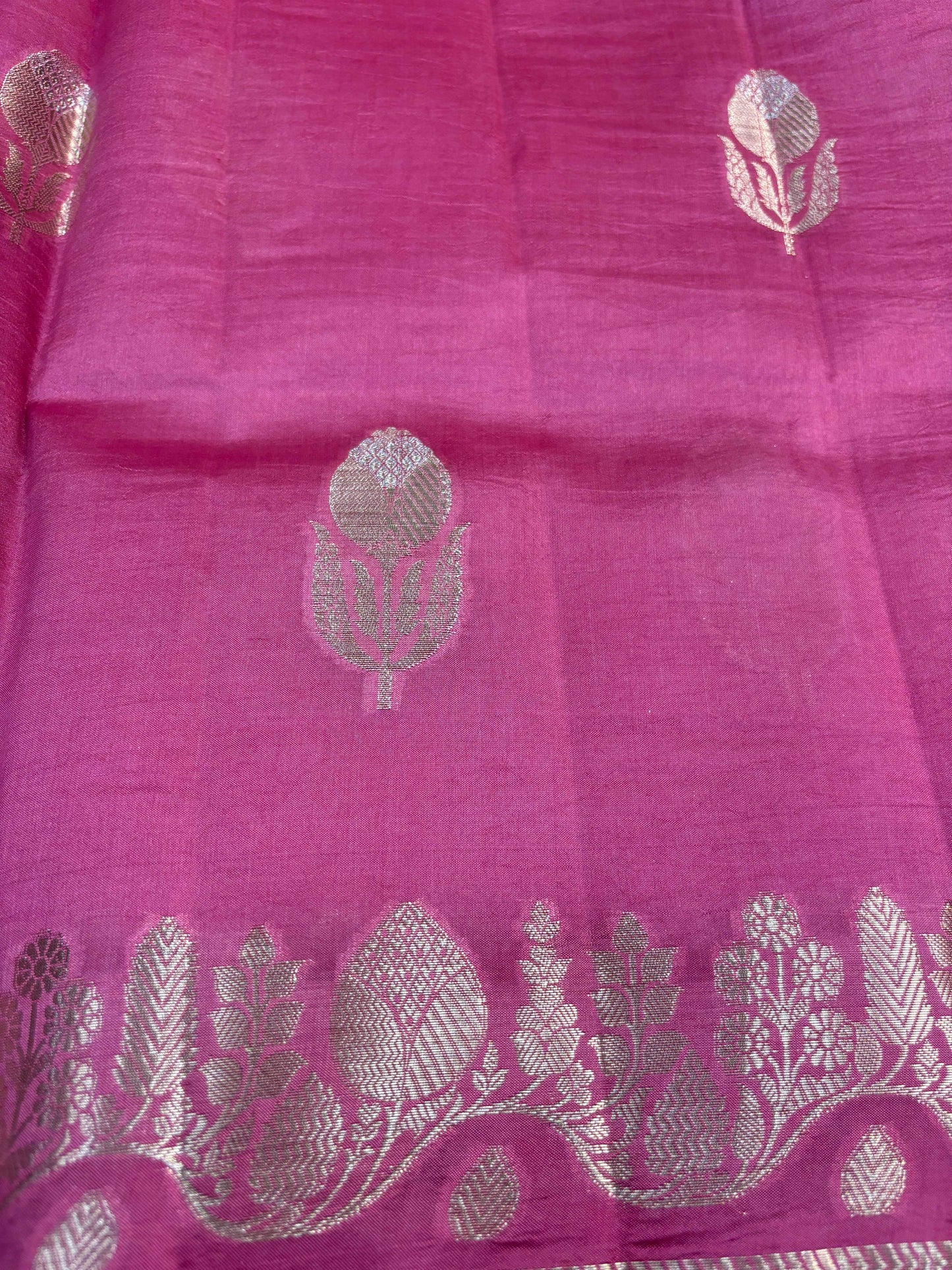 Pink Banarasi saree with scattered leaf motifs and zari hem