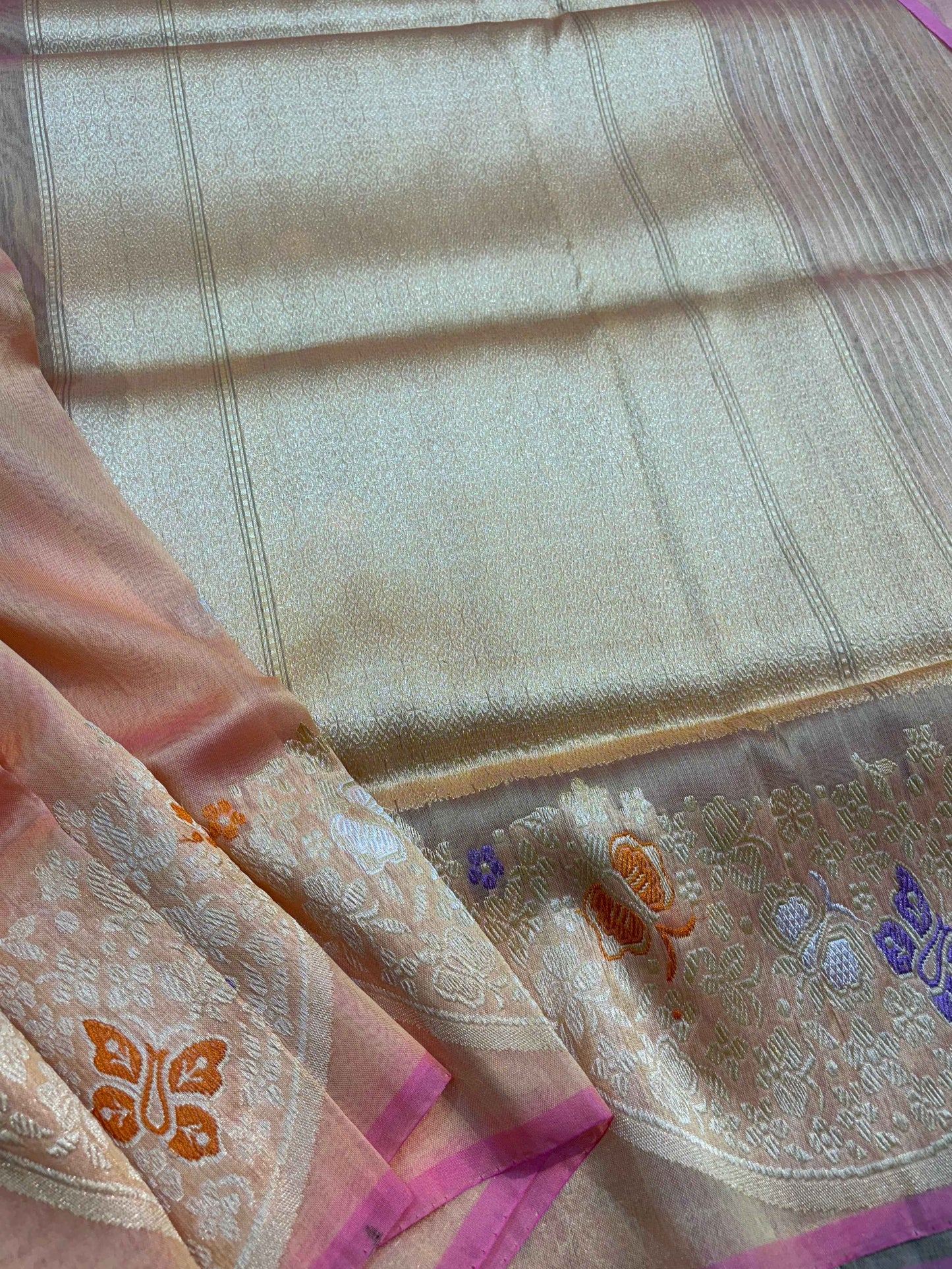 Pink and cream silk saree pallu with floral zari motifs and magenta border edge