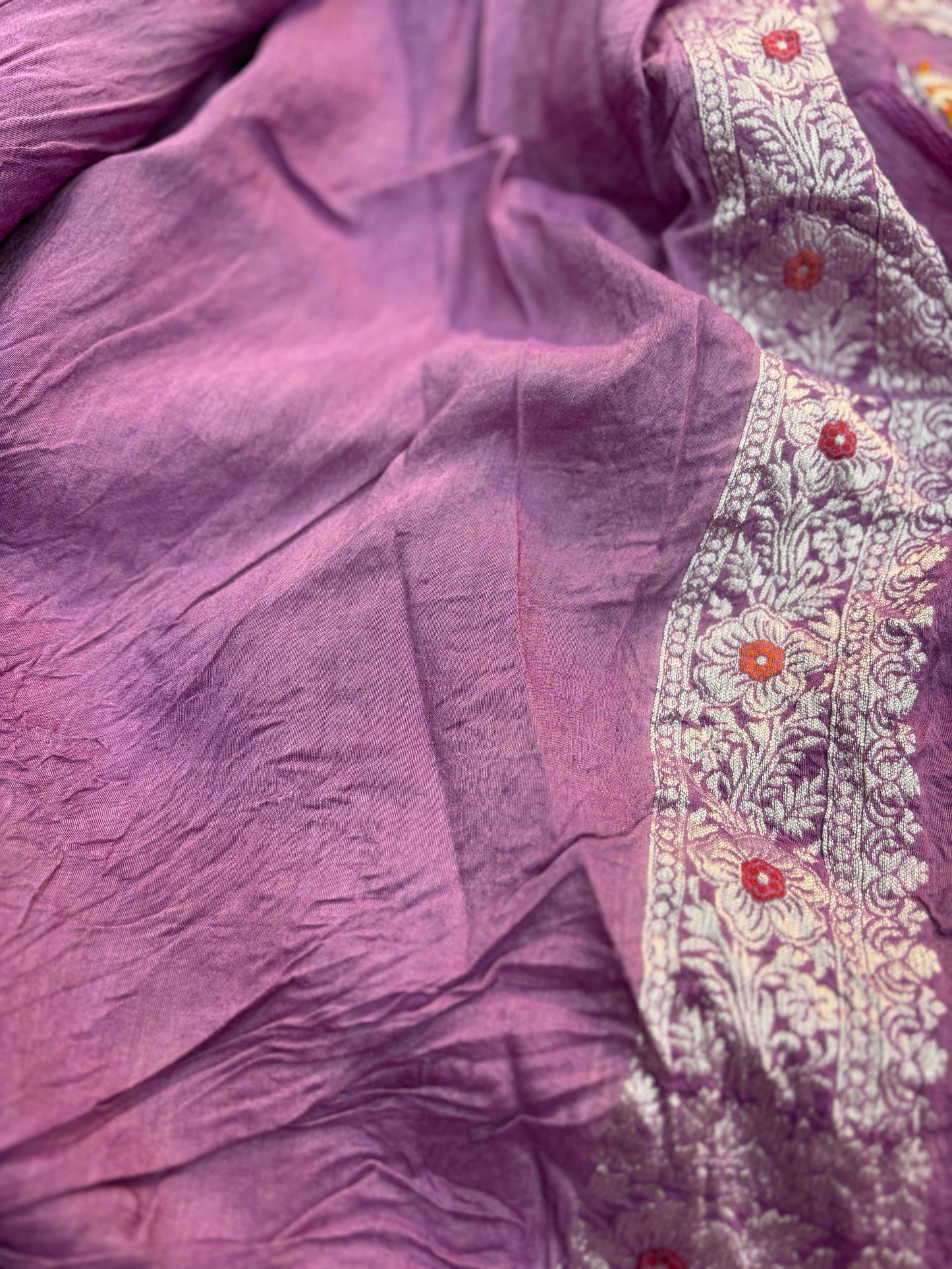 Lavender sari with cream-gold embroidered border and red floral accents