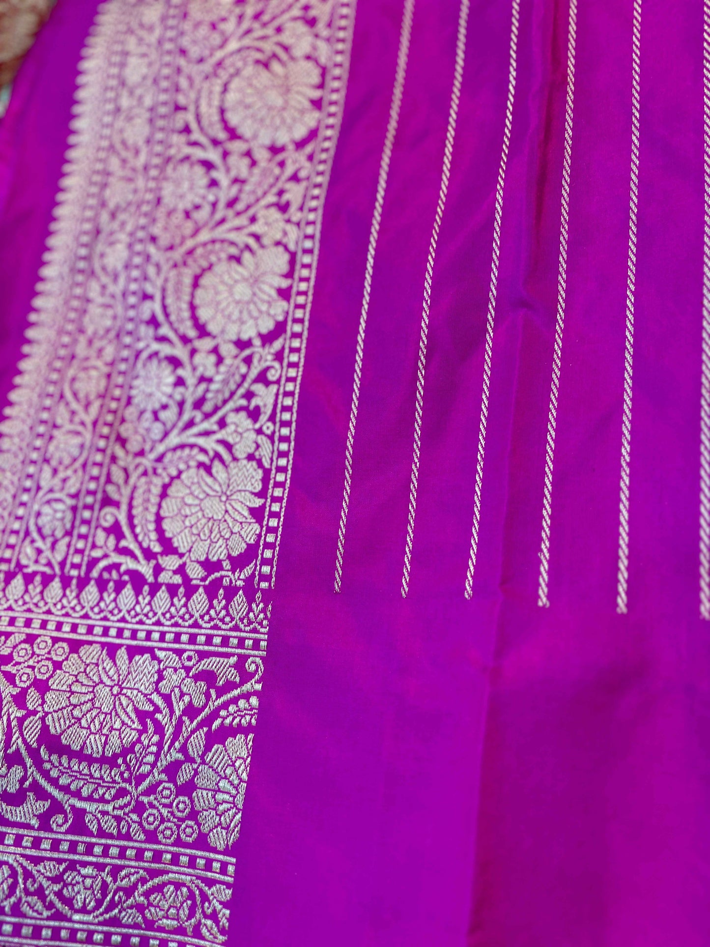 Purple saree with embroidered panel and vertical striped detailing, woven border