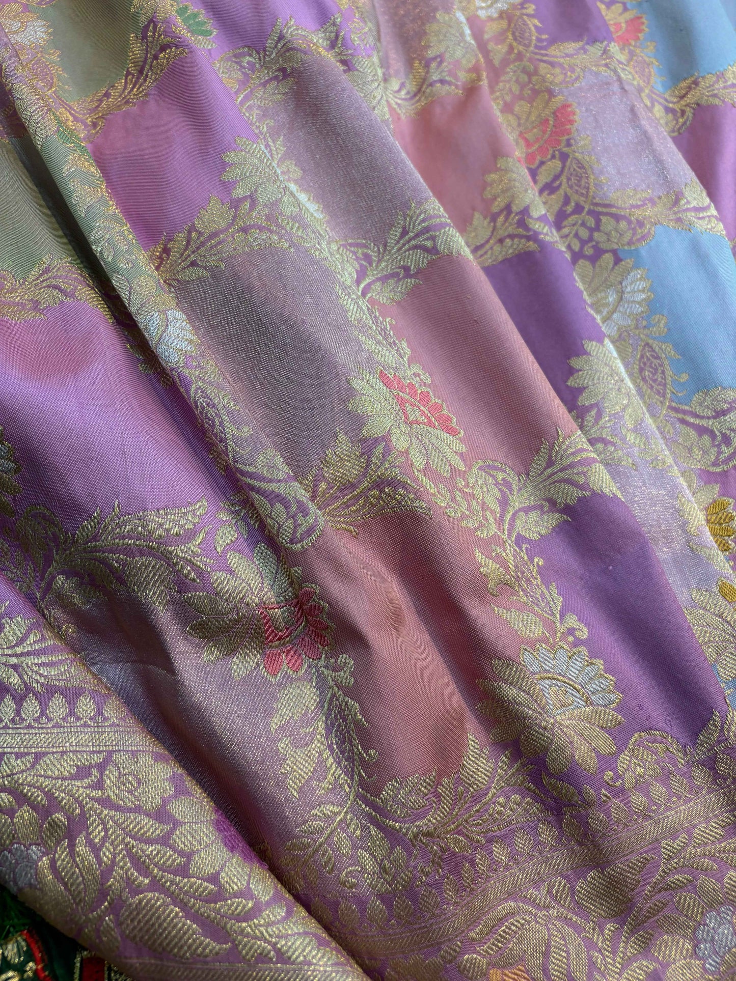 Lavender saree with allover gold floral brocade and softly shaded stripes