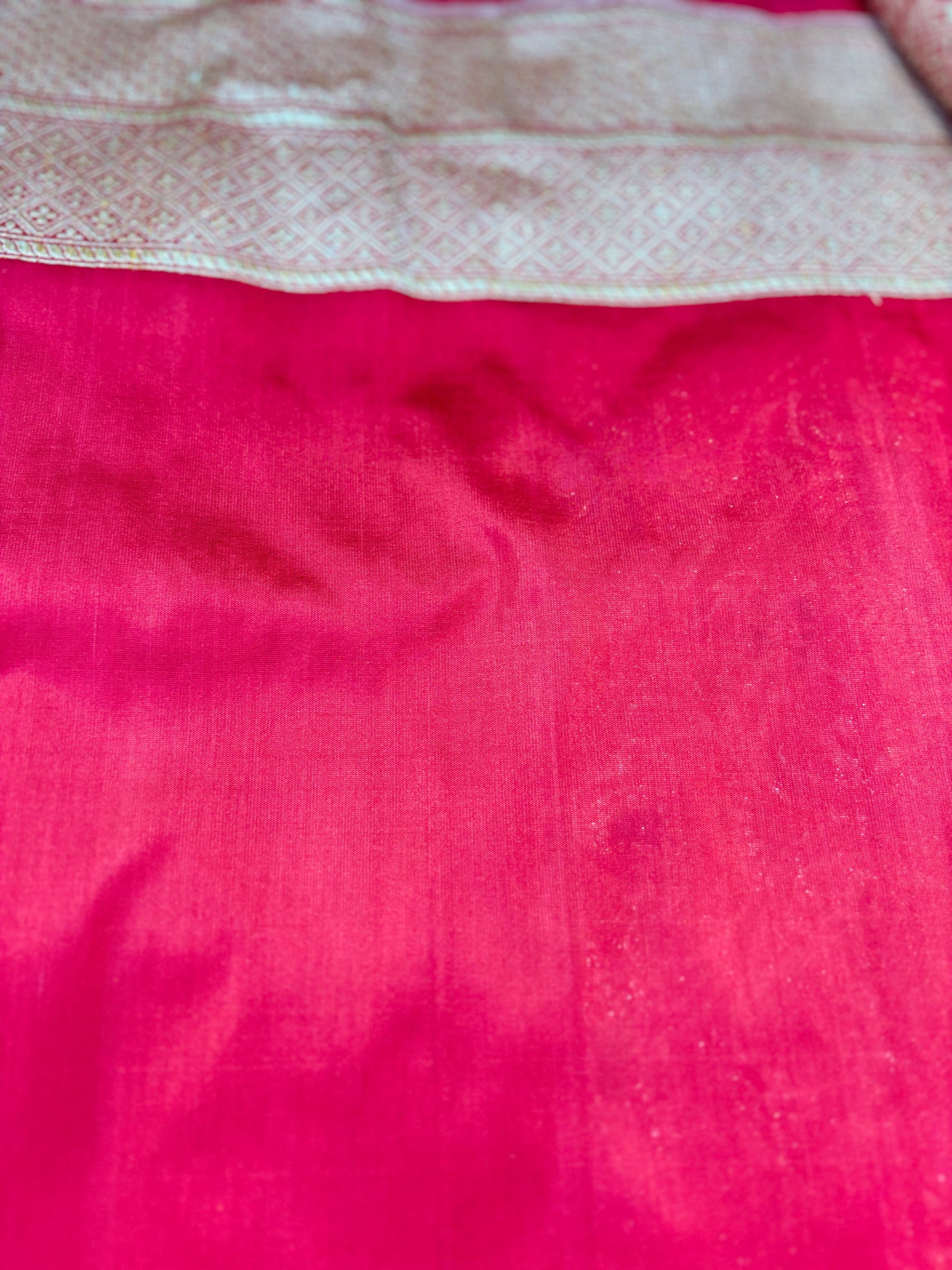 Magenta pink handwoven saree with subtle brocade texture and woven border