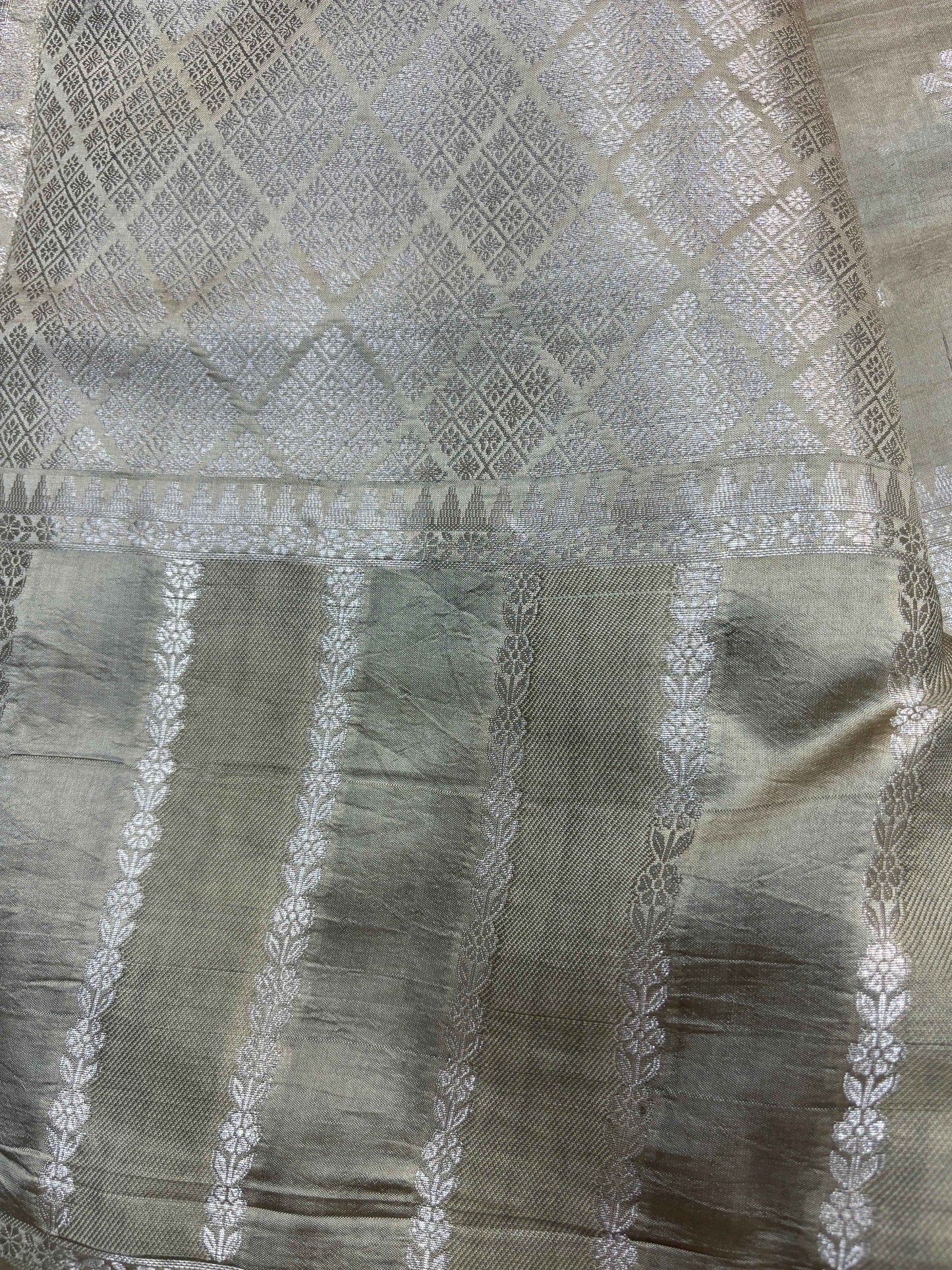 Light gray Banarasi handloom saree with diamond jacquard and silver vine motifs