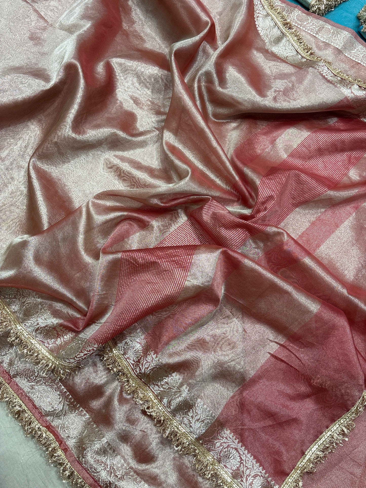 Rose-gold tissue saree with pink panels and gold lace-trimmed border
