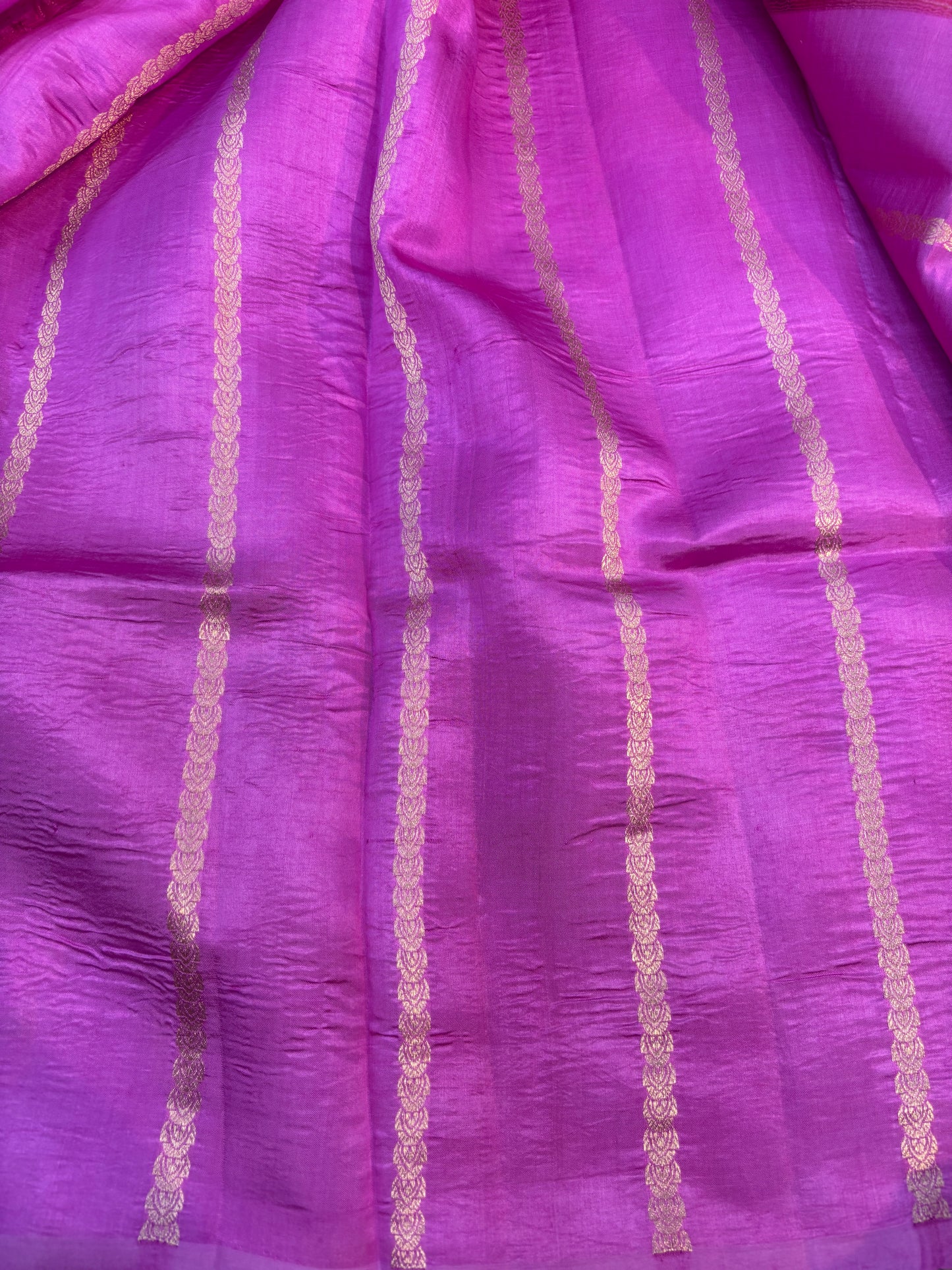 Purple saree with gold vertical stripes and woven texture