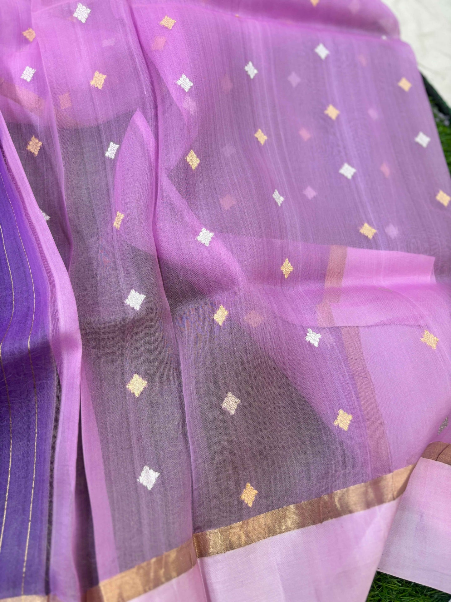 Lavender saree with small gold and white diamond motifs and gold zari border.