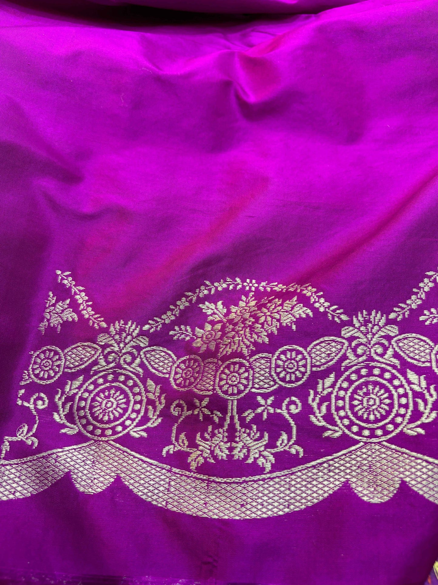 Purple silk saree with silver zari floral band and ornate scalloped end border