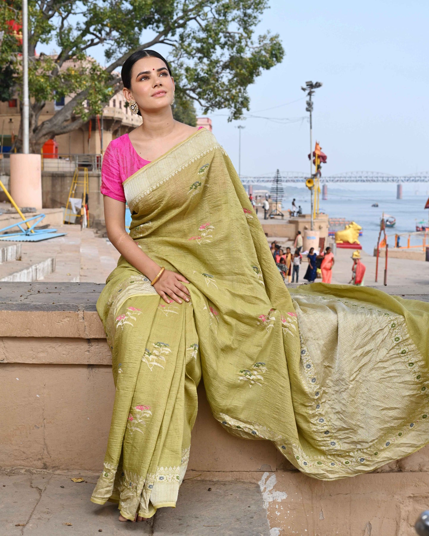 Green tussar georgette saree with gold border and small floral motifs
