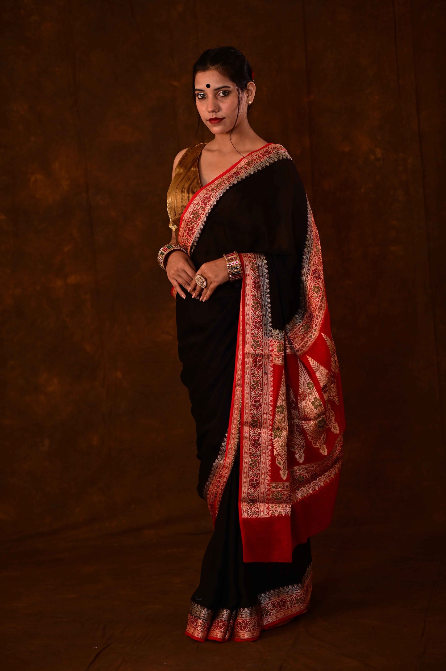 Black and red chiffon Banarasi handloom saree with wide red-gold border and pallu