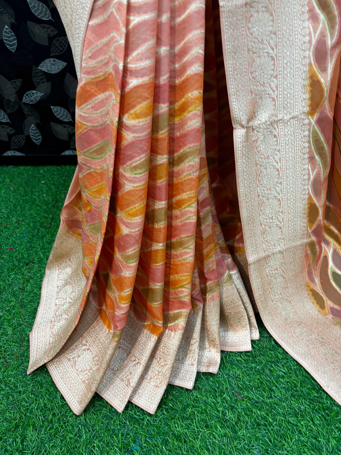 Banarasi georgette saree drape with orange multicolor stripes and cream brocade border