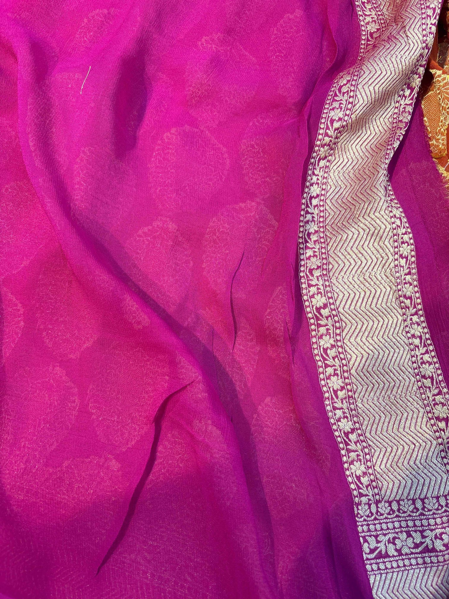 Fuchsia khadi georgette sari with silver zigzag border detail
