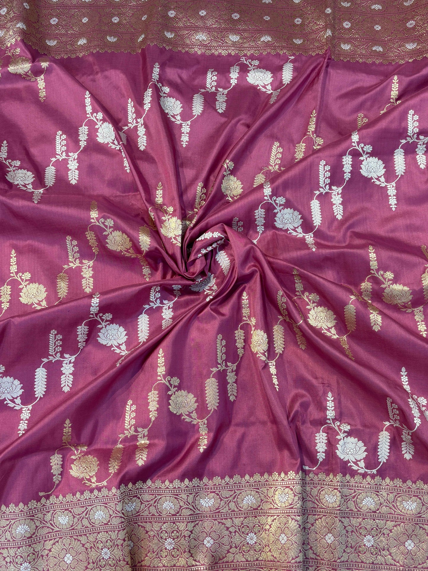 Lavender saree with scattered white, gold, and teal floral motifs