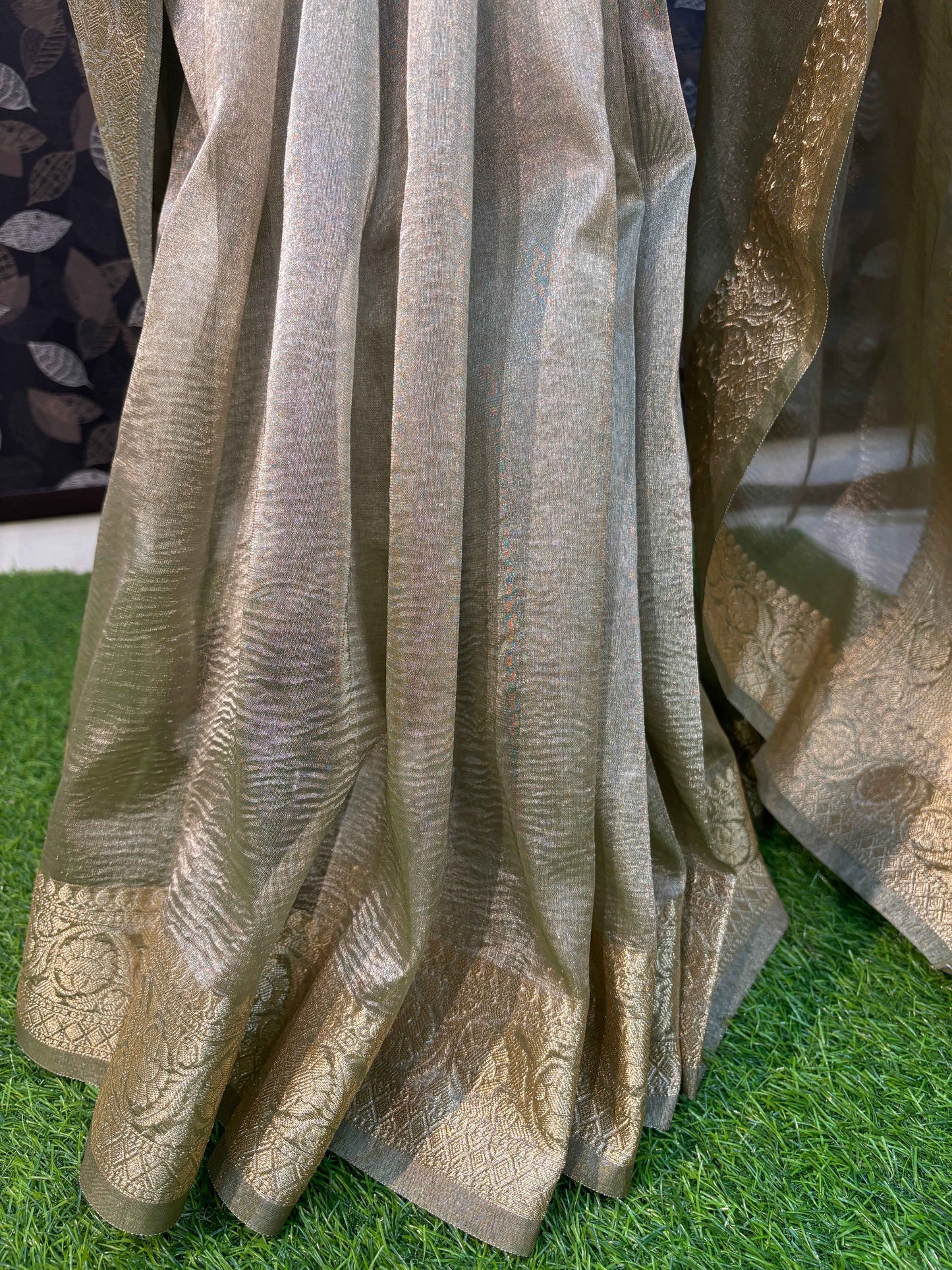 Light gray saree with pleated fall and gold zari edging
