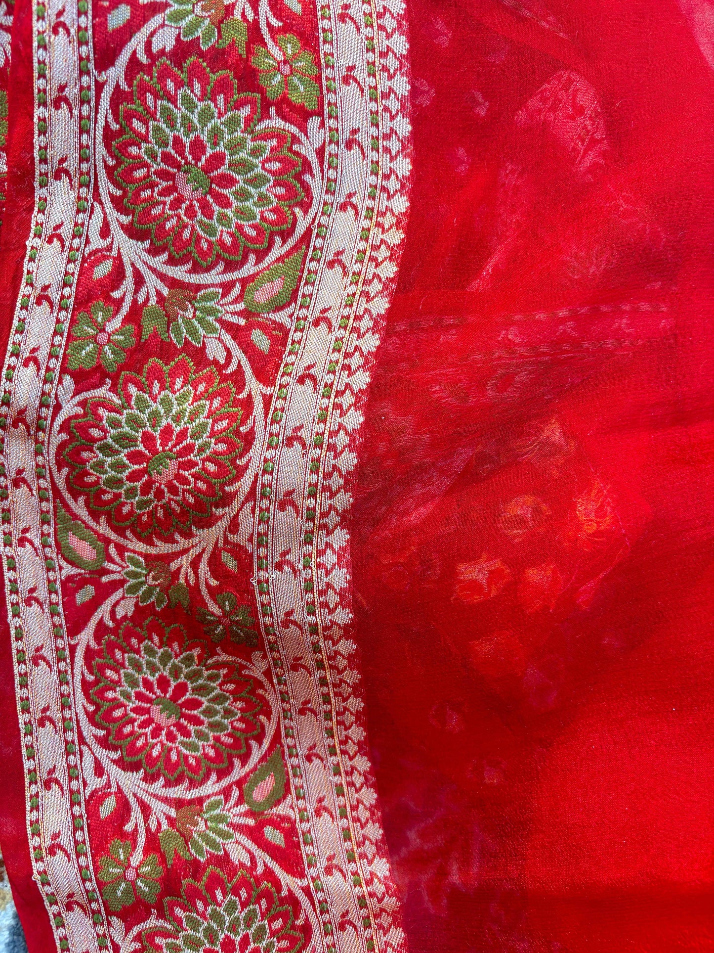 Red chiffon saree panel with green and pink floral vine motifs and cream trim
