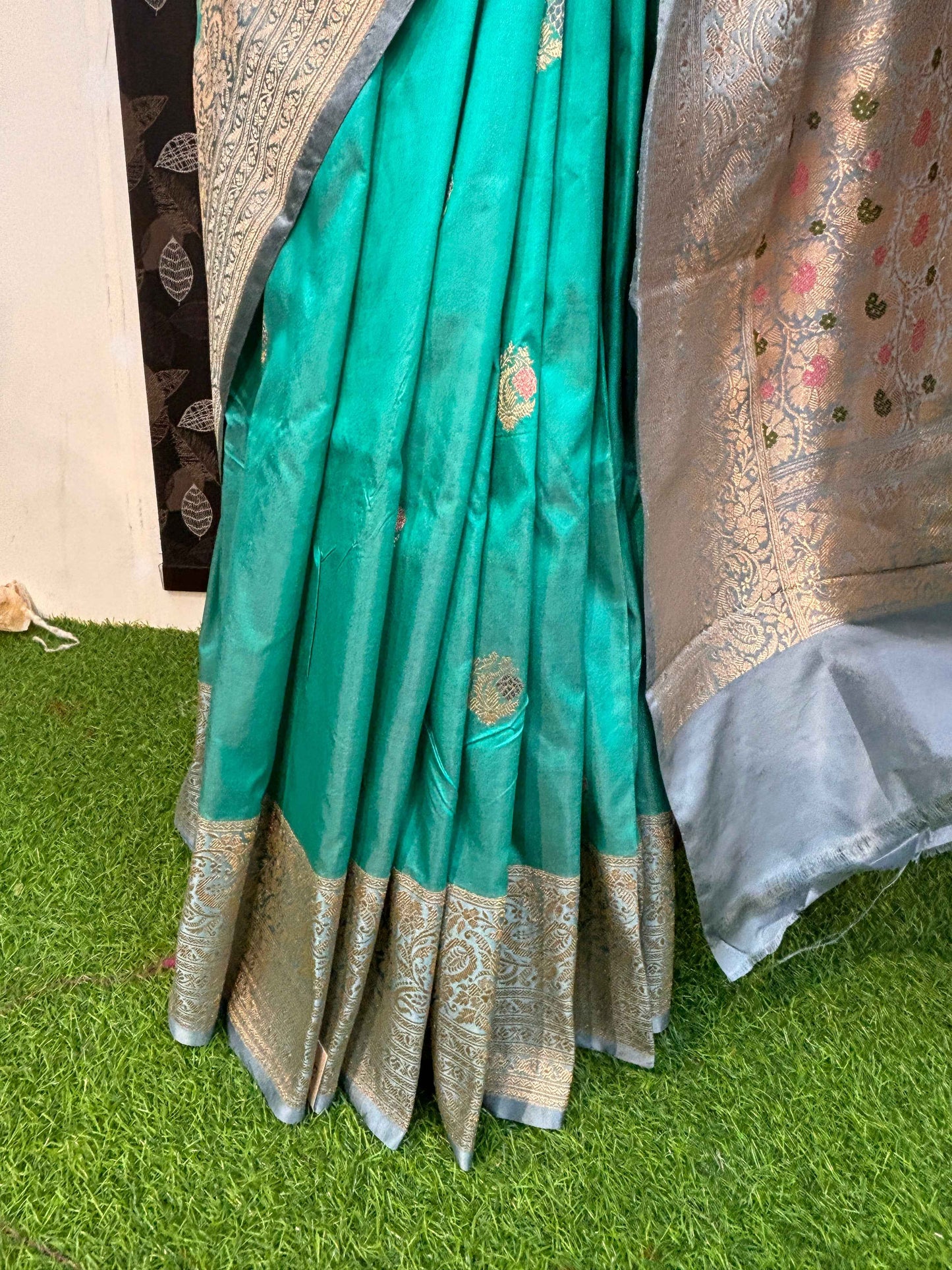 Turquoise saree with wide silver border, gold motif band, pleated skirt