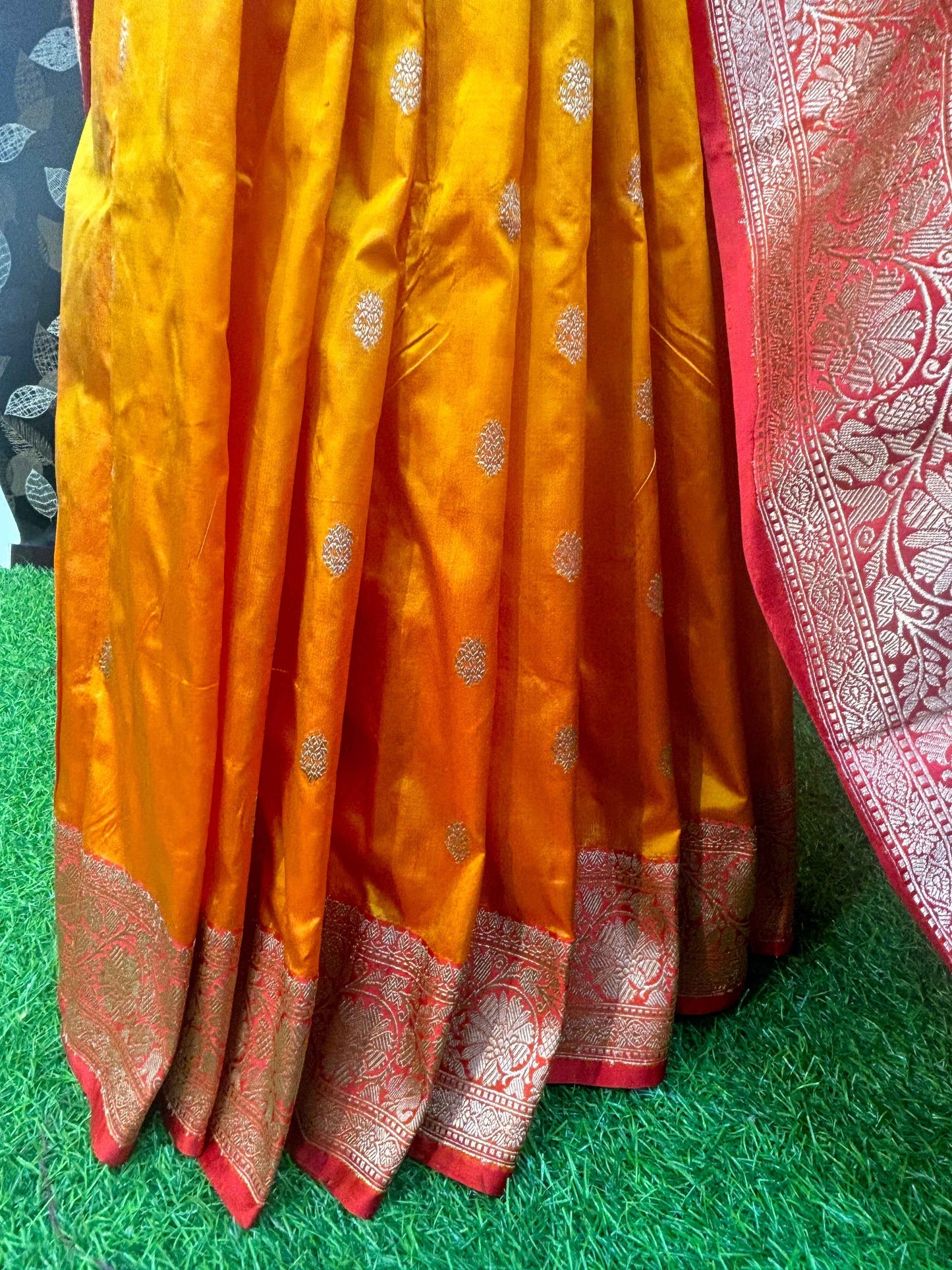Banarasi handloom saree pleats in golden yellow with small motifs and red zari hem