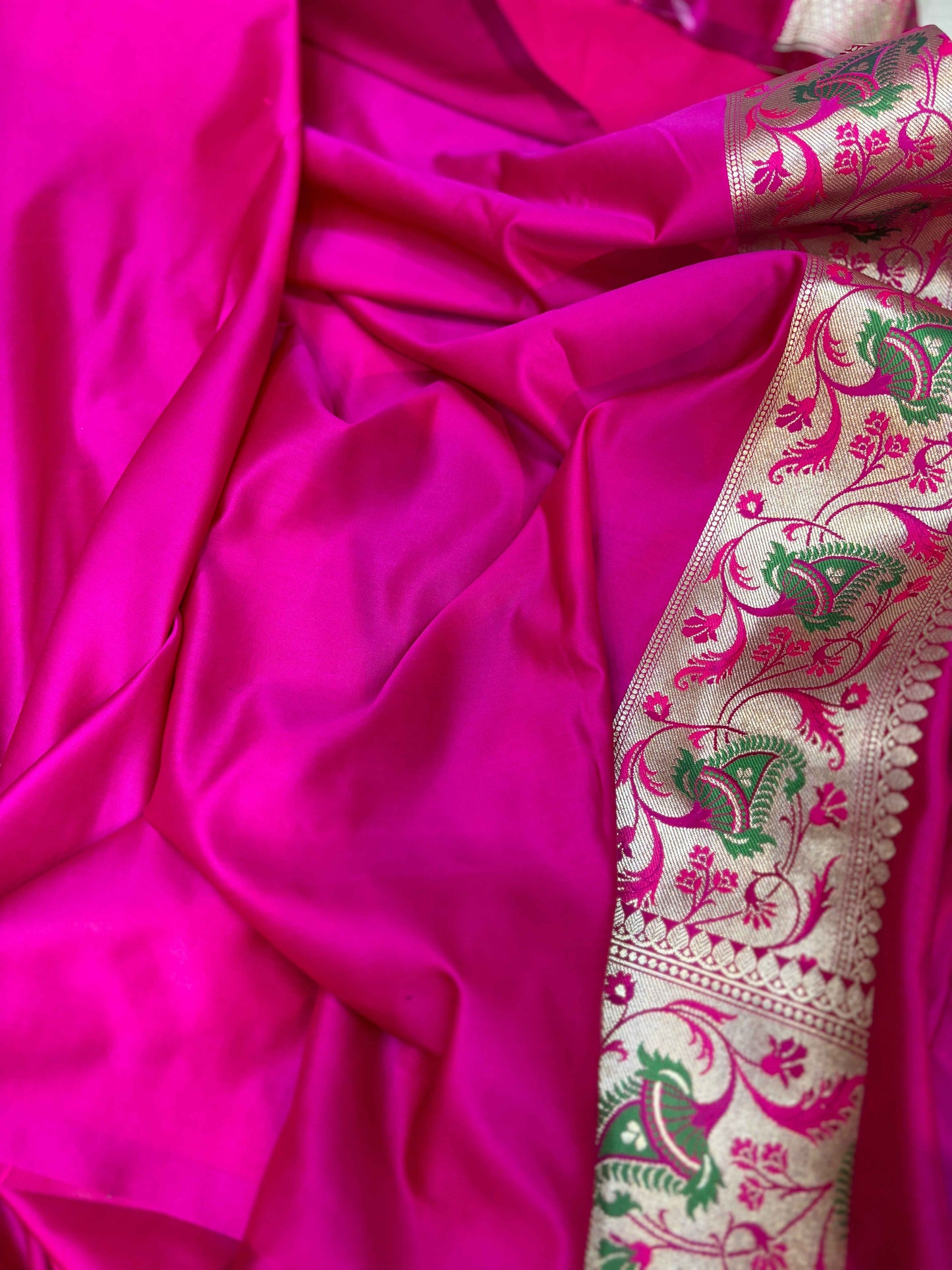 Fuchsia silk saree fabric with decorative green and magenta border
