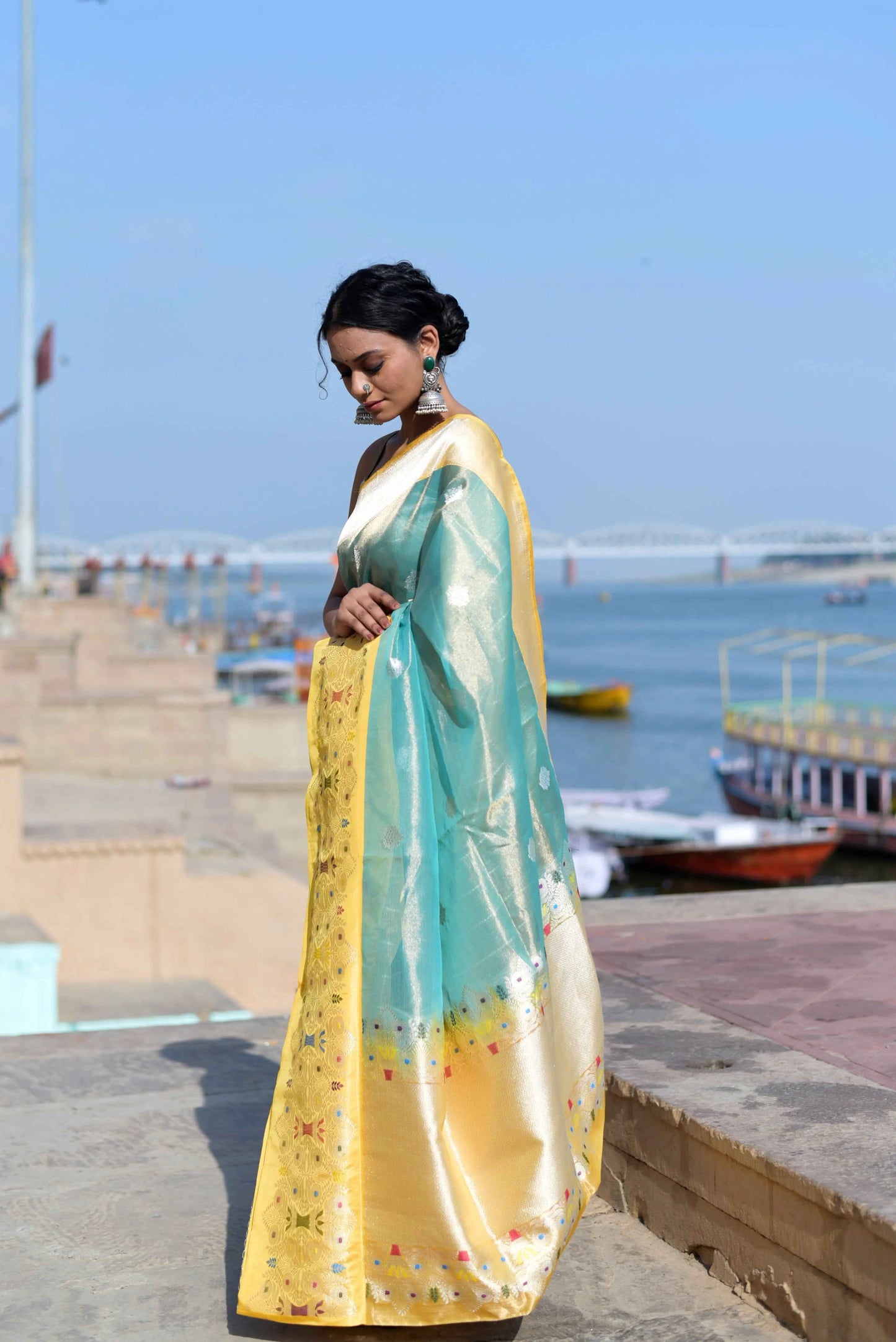 Light blue and yellow saree with gold border, patterned body and pallu