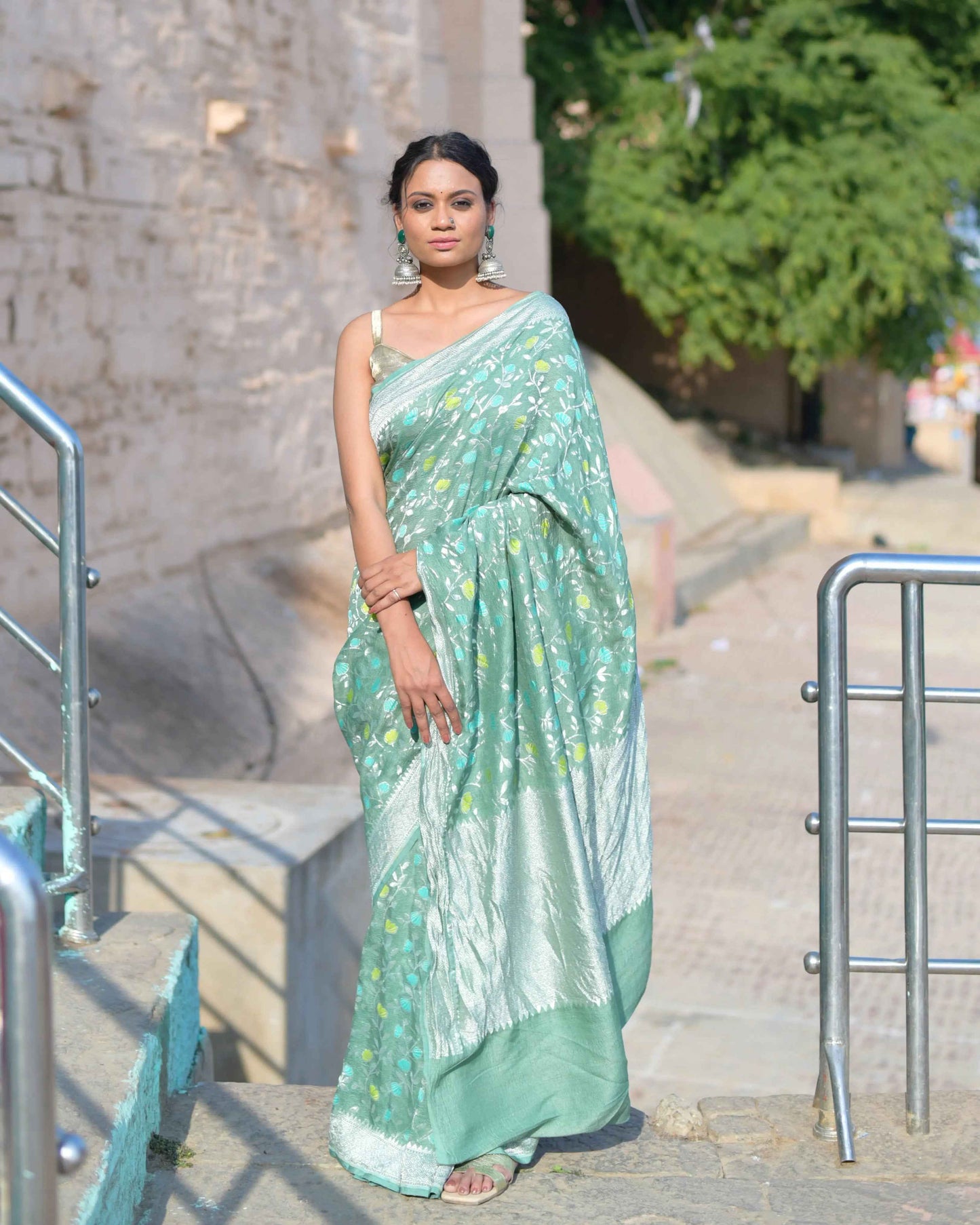 Light green handwoven saree with sheer georgette drape and woven motifs