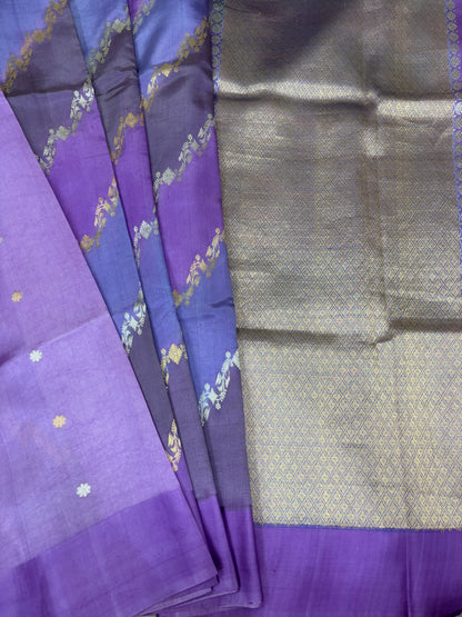 Handloom silk saree with lavender body, dark blue border, gold motifs and zari sheen