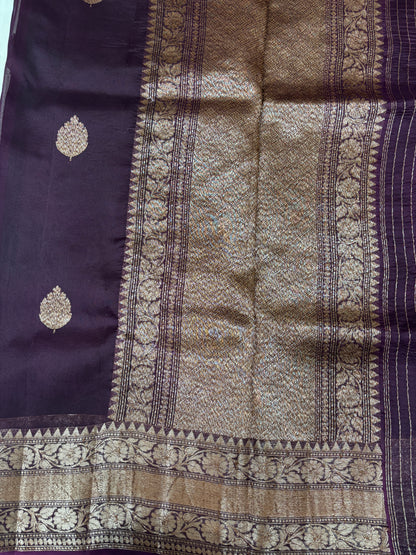 Purple silk saree with gold pallu panel, vertical zari stripes, and patterned border
