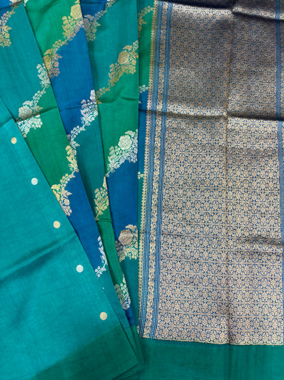 Teal and green Banarasi silk saree with ornate vine border and patterned pallu