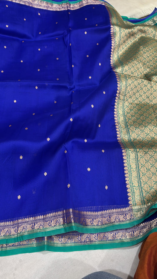 Royal blue silk Banarasi saree with gold and green zari border