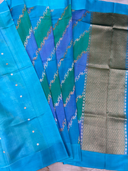 Blue silk saree with chevron floral pattern and wide gray-silver border