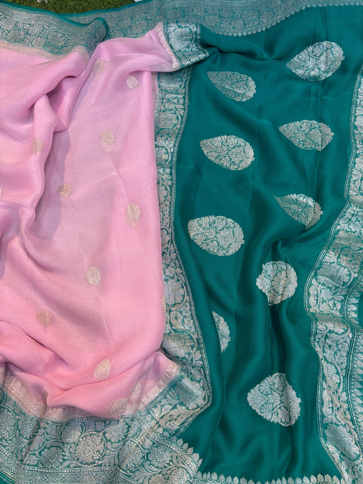 Pink and teal chiffon saree with silver border and scattered gold-toned motifs