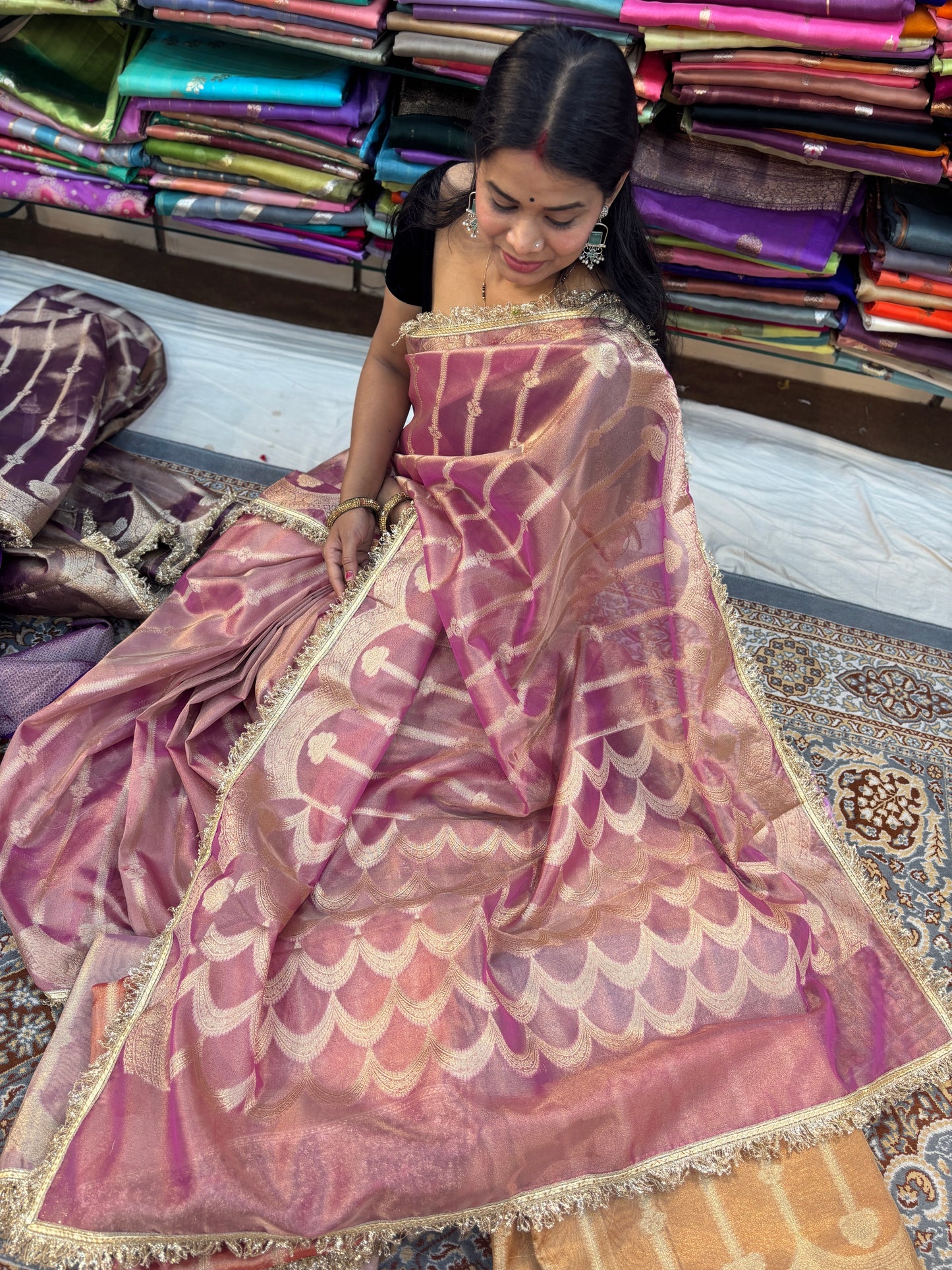 Mauve tissue saree with gold-toned lace border and scalloped motif pallu