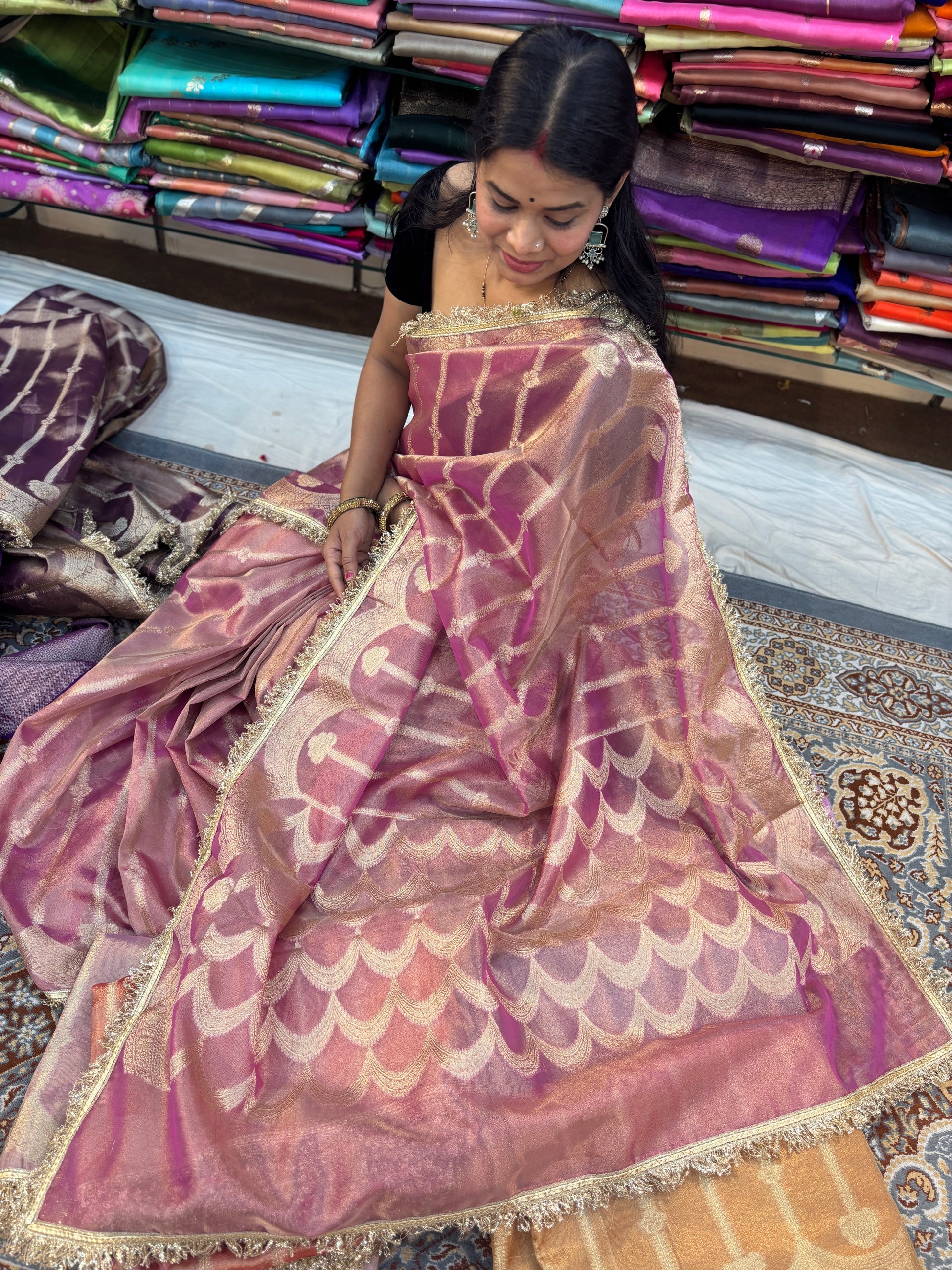 Mauve tissue saree with gold-toned lace border and scalloped motif pallu