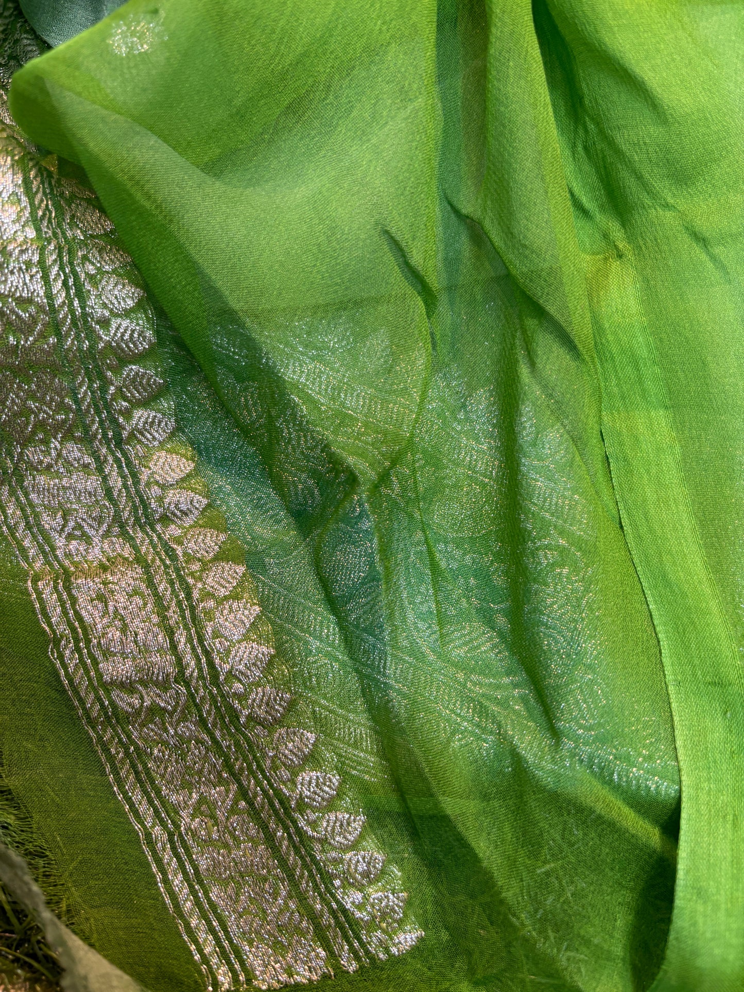 Green chiffon saree with silver zari boota and woven border detail
