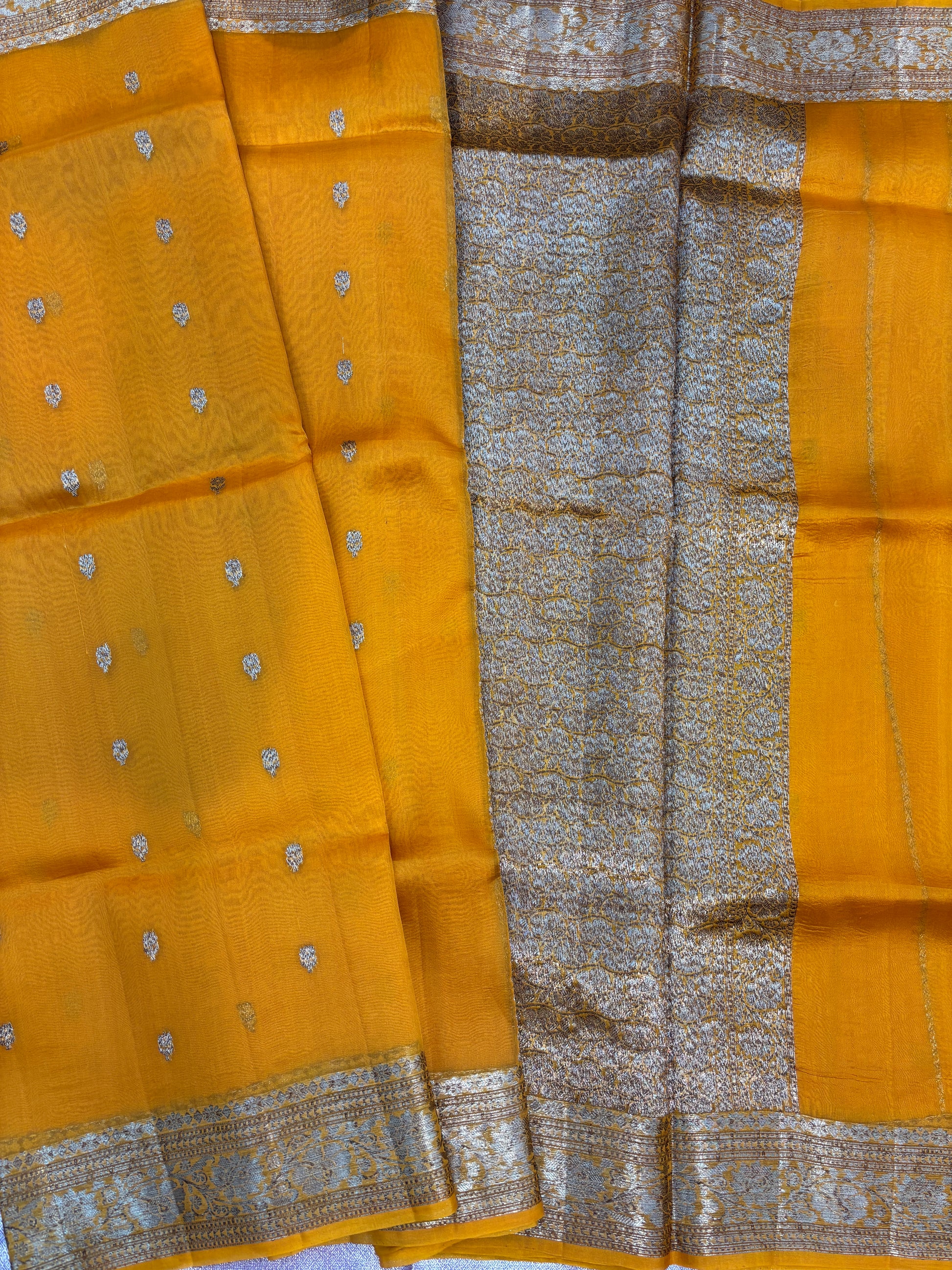 Mustard yellow saree with silver dots and grey pallu panel with woven silver border
