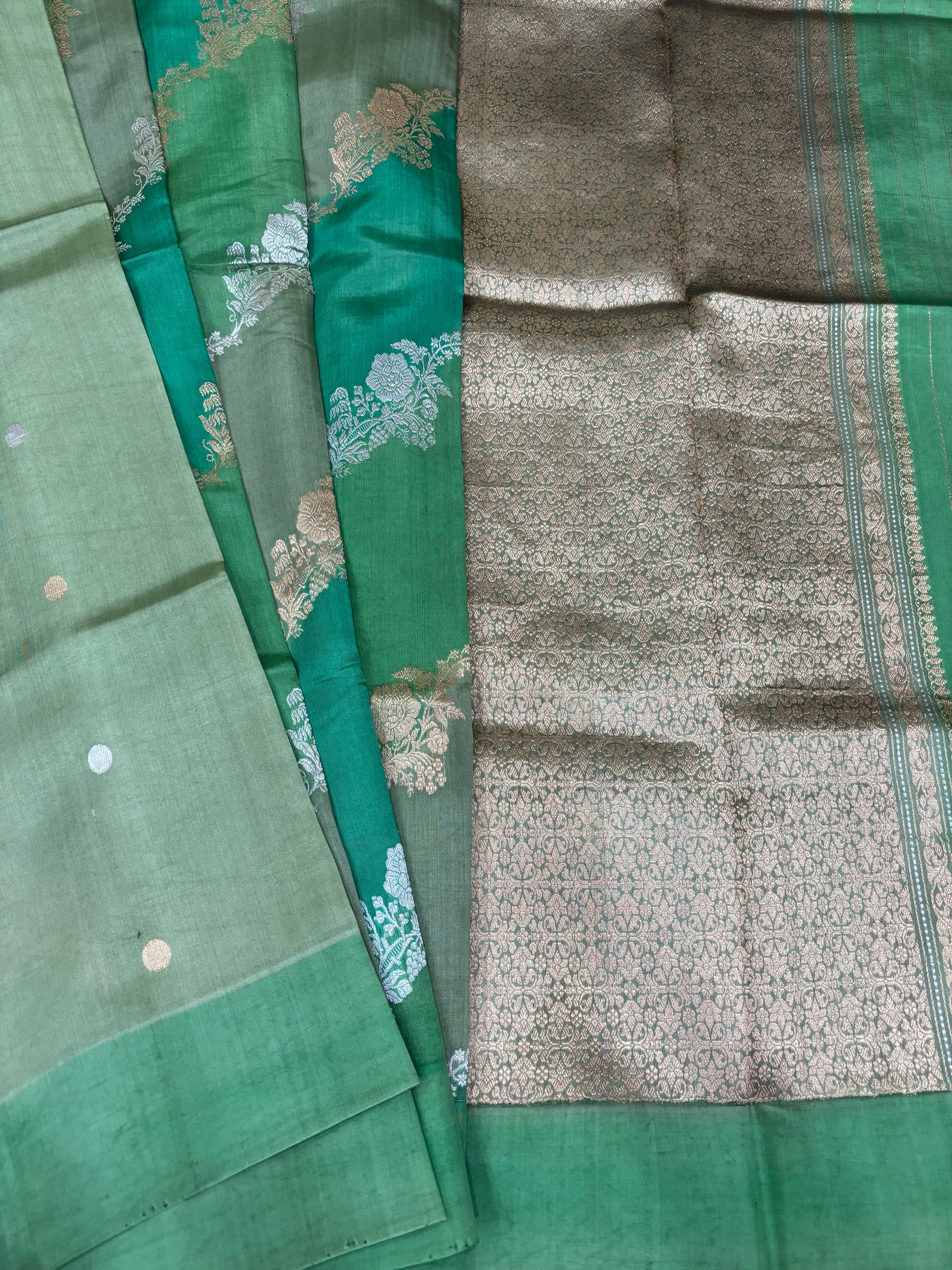 Green silk saree with teal and silver patterned sections plus contrast border